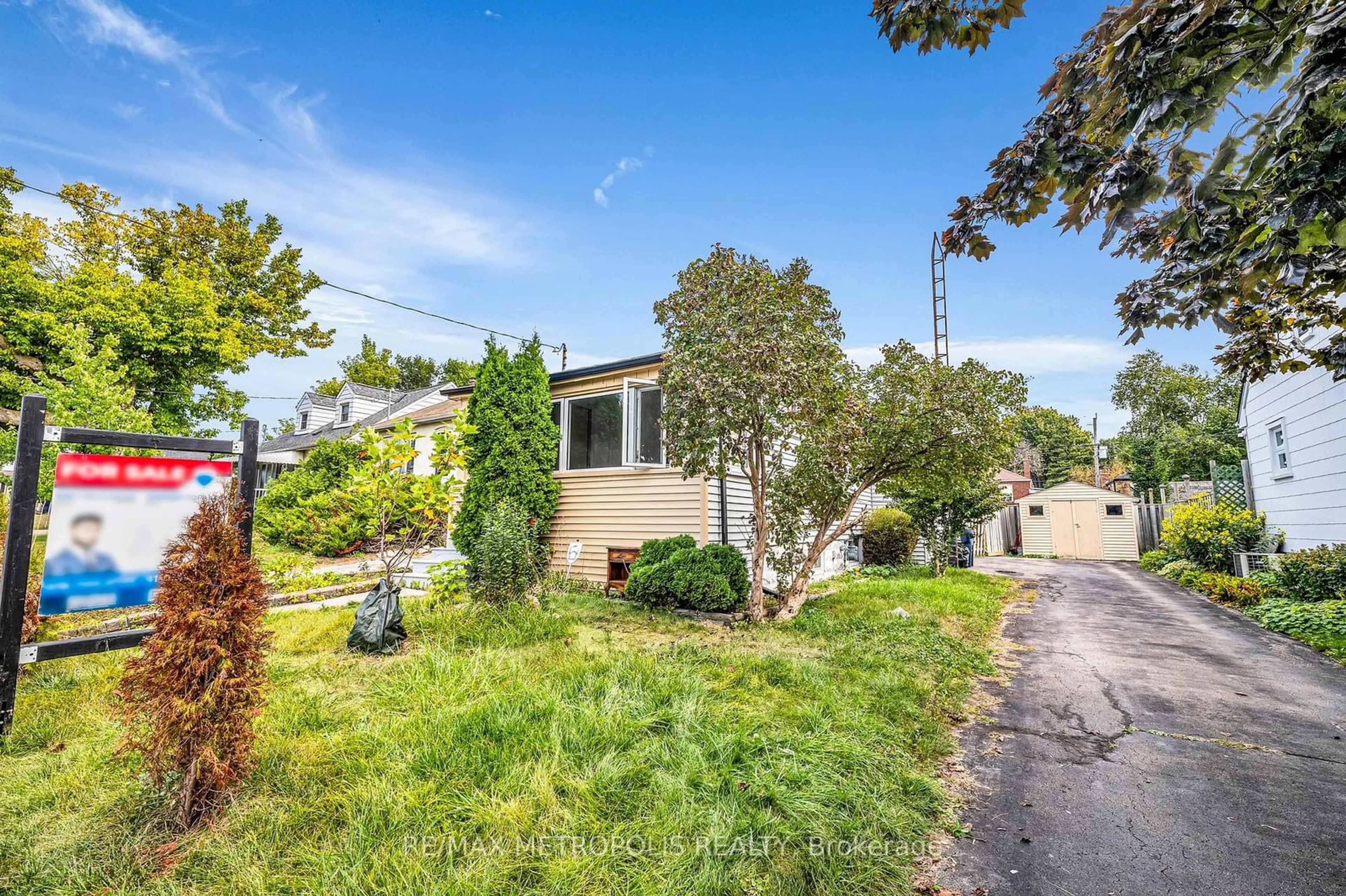 A pic from exterior of the house or condo, the fenced backyard for 97 N Woodrow Blvd, Toronto Ontario M1K 1W7