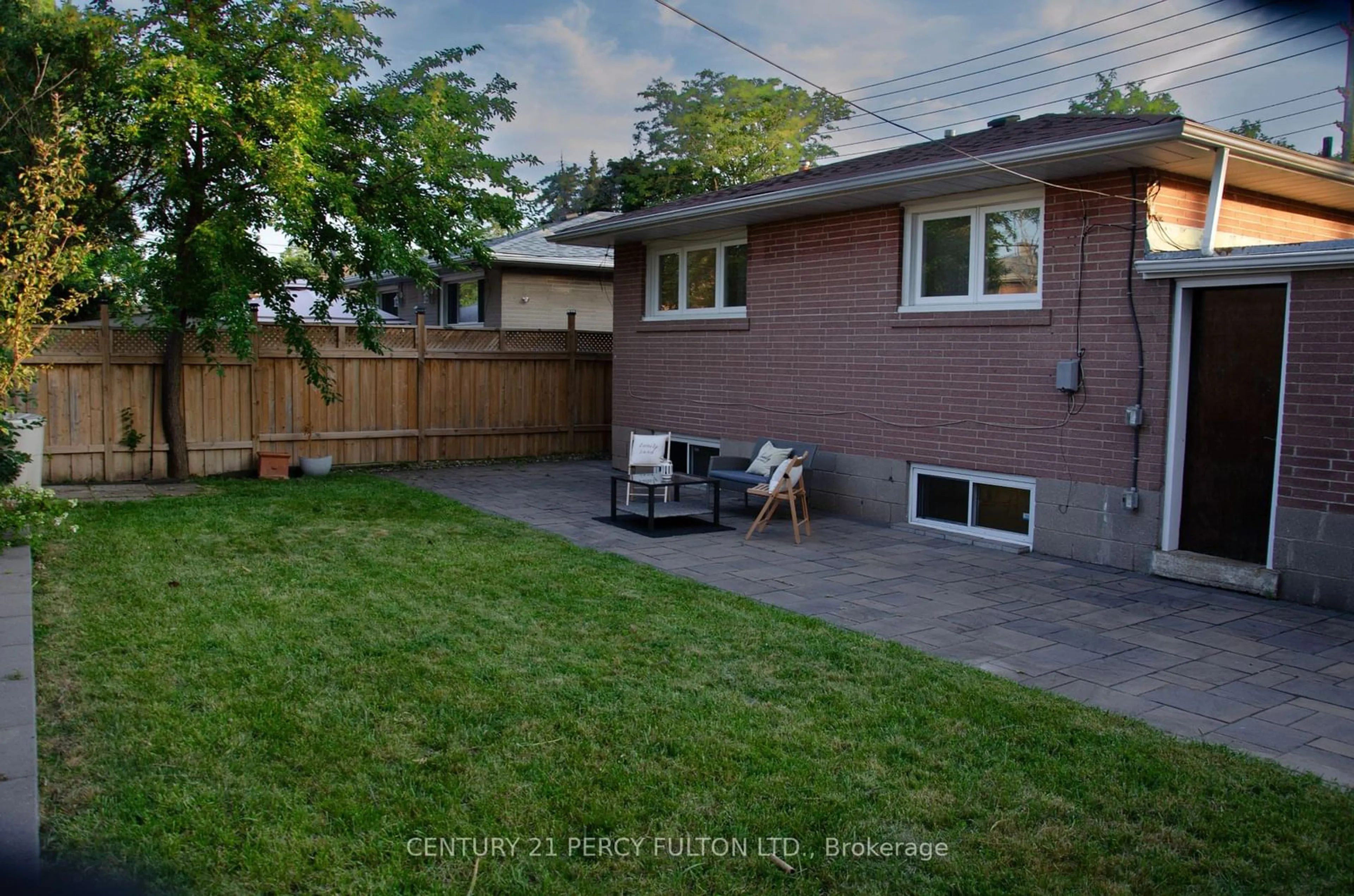 Frontside or backside of a home, the fenced backyard for 869 Scarborough Golf Club Rd, Toronto Ontario M1G 1J4