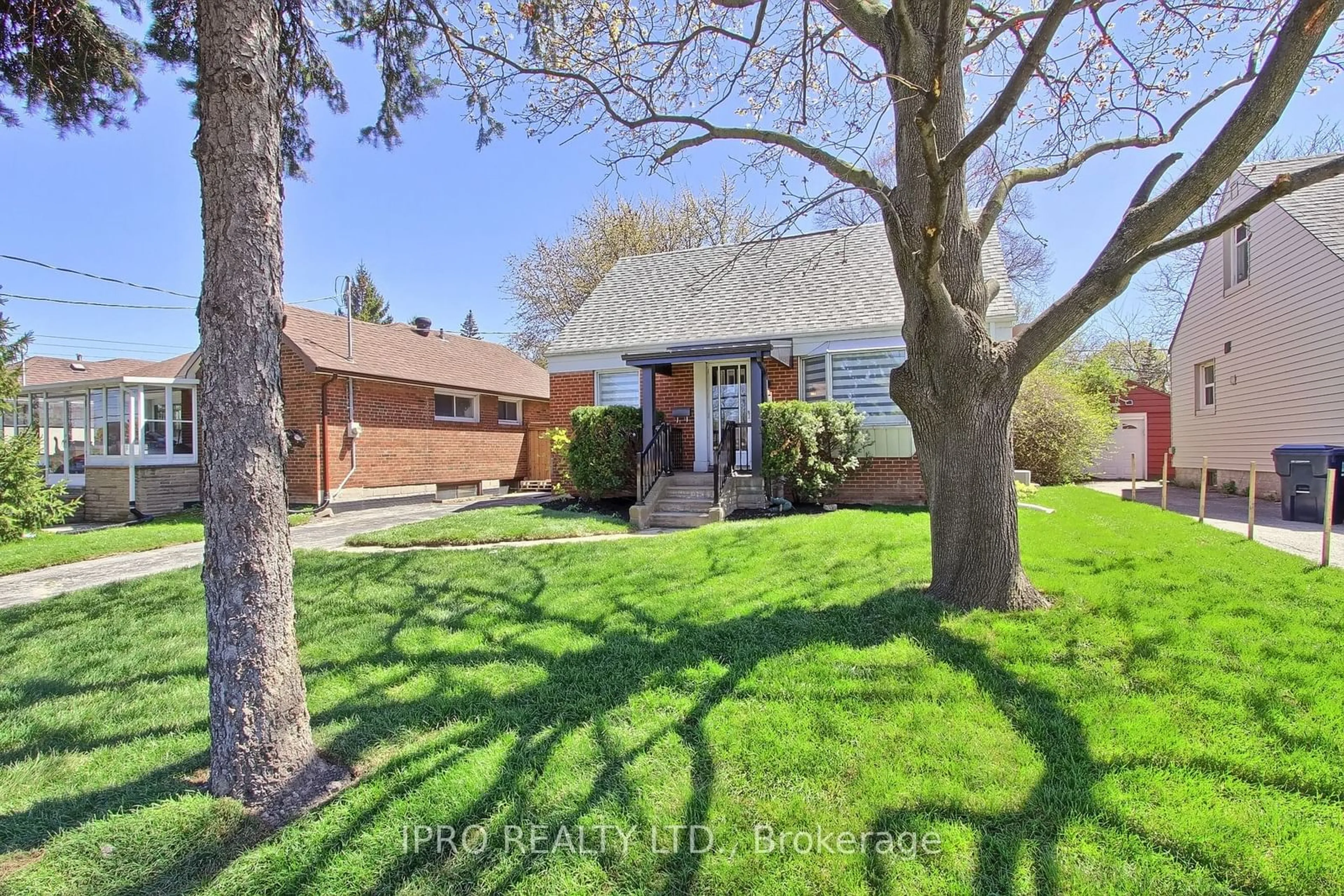 Frontside or backside of a home, the fenced backyard for 165 Ellesmere Rd, Toronto Ontario M1R 4C7