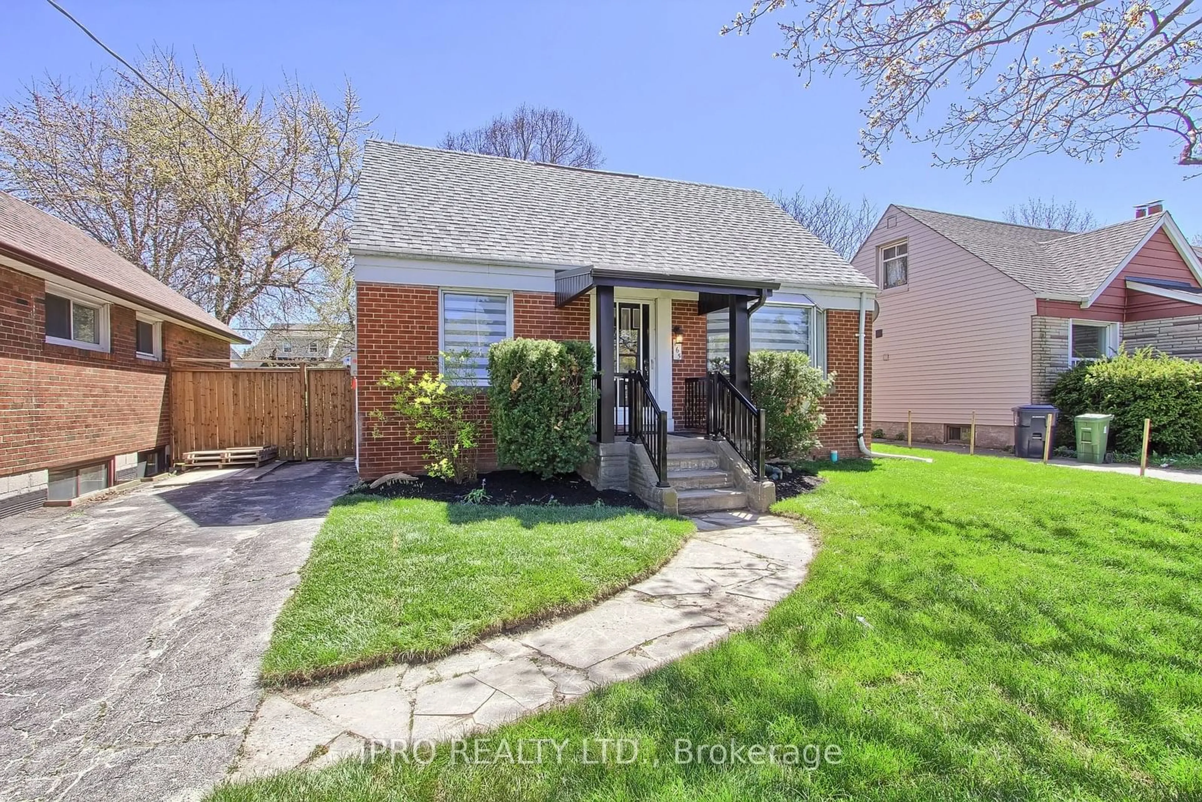 Frontside or backside of a home, the fenced backyard for 165 Ellesmere Rd, Toronto Ontario M1R 4C7