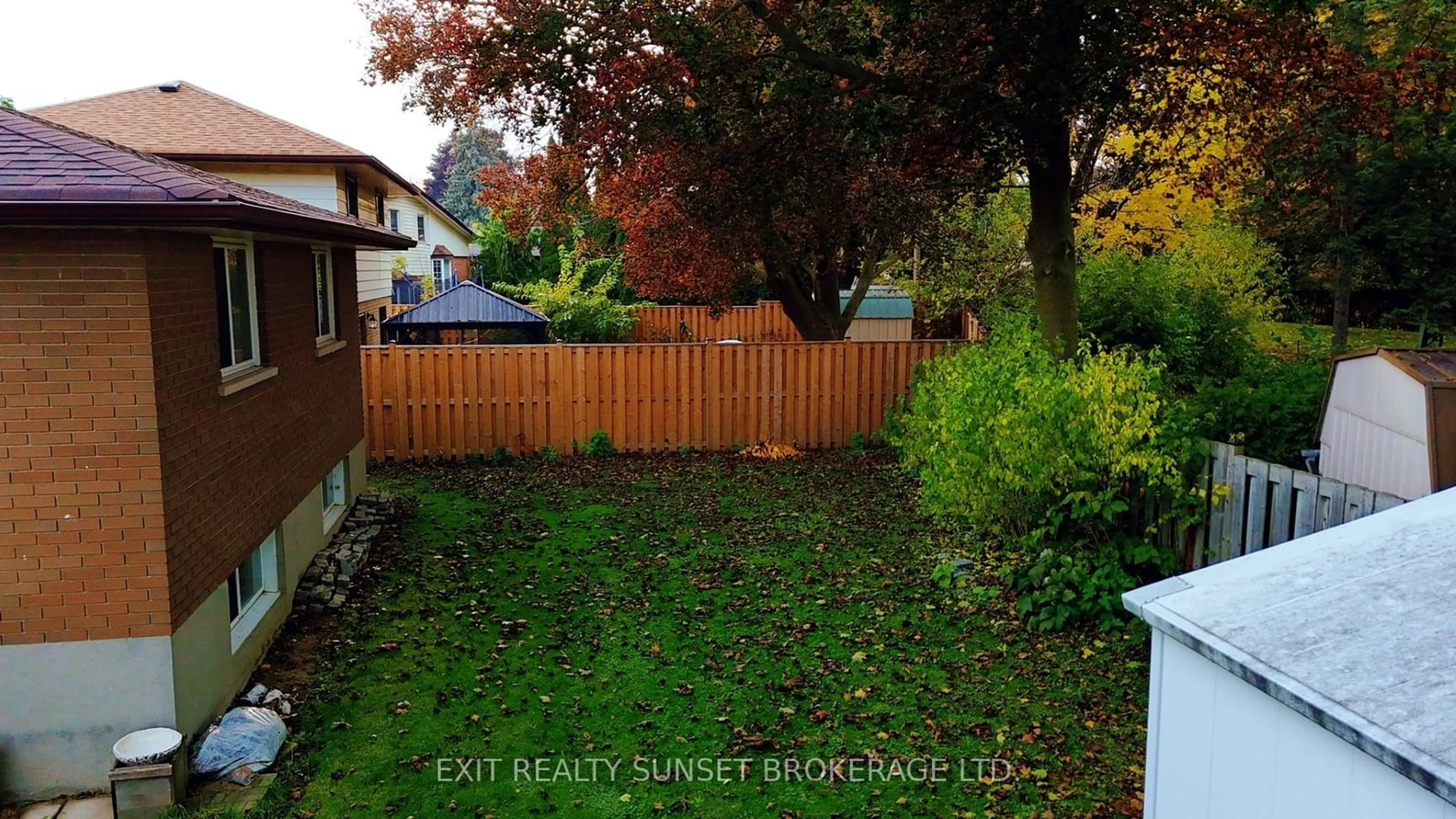 Frontside or backside of a home, the fenced backyard for 376 Adelaide Ave, Oshawa Ontario L1G 2A1