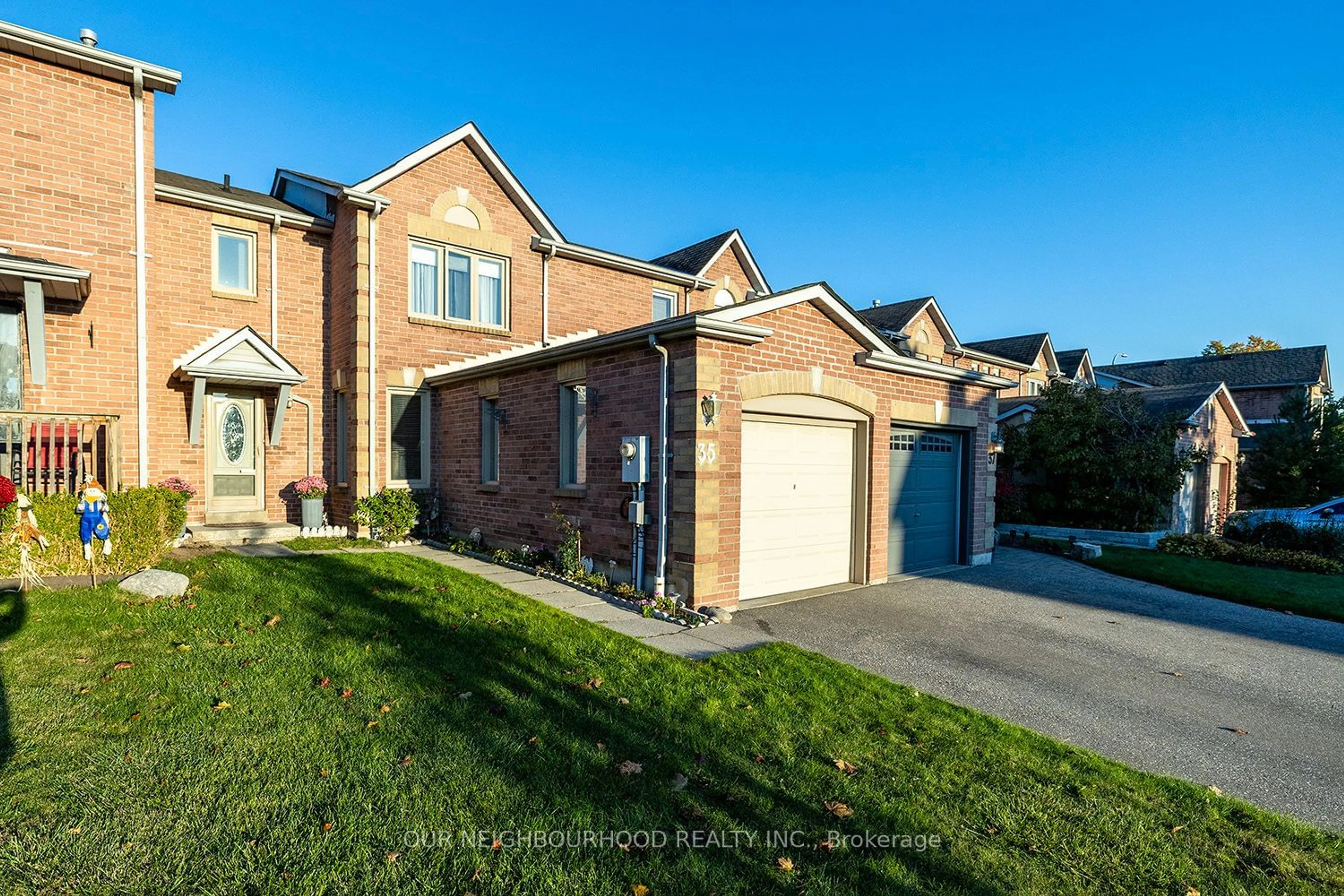 A pic from exterior of the house or condo, the fenced backyard for 35 Woodstone Pl, Whitby Ontario L1R 1S8