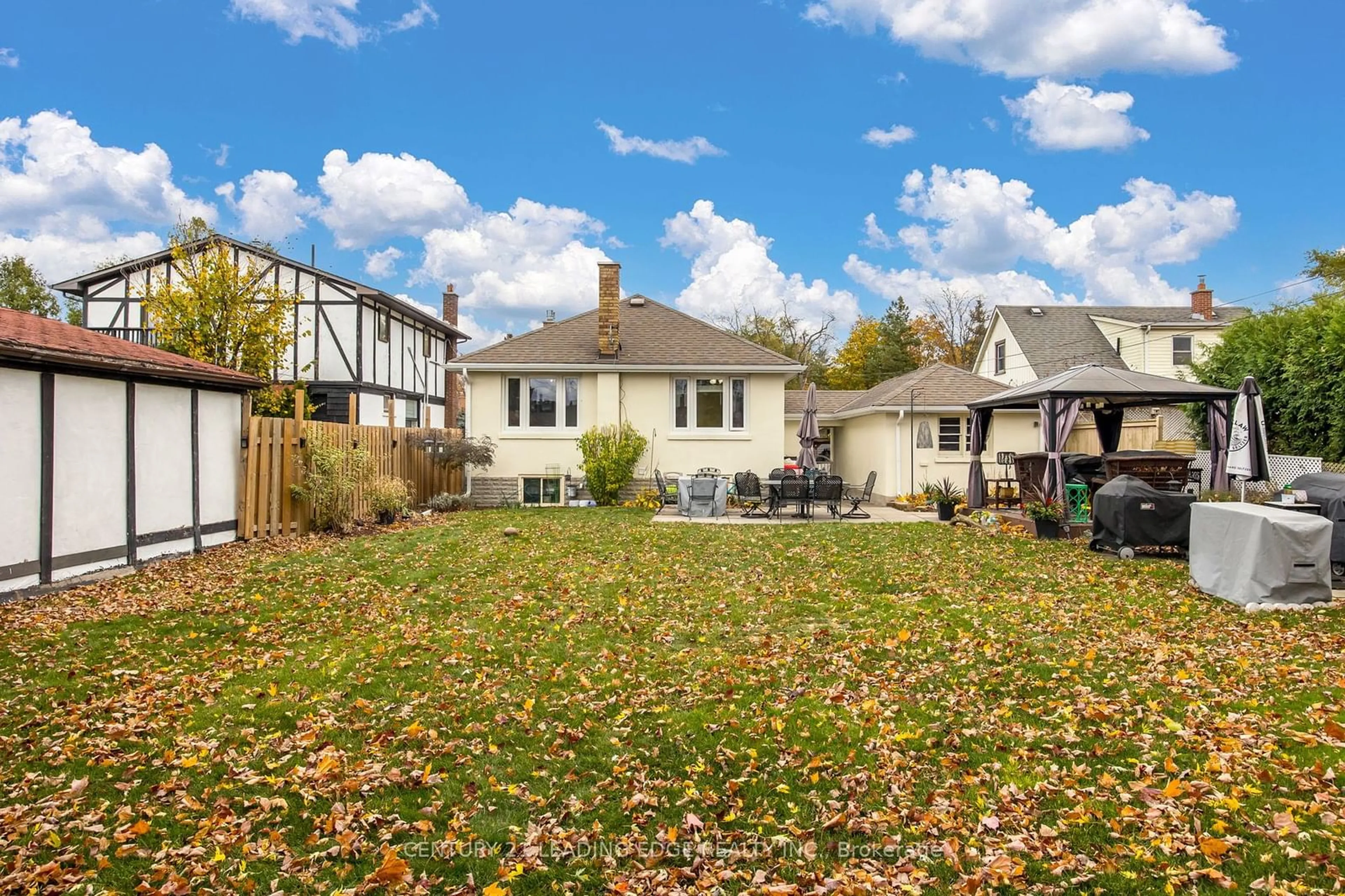 Frontside or backside of a home, the fenced backyard for 52 Amiens Rd, Toronto Ontario M1E 3S8