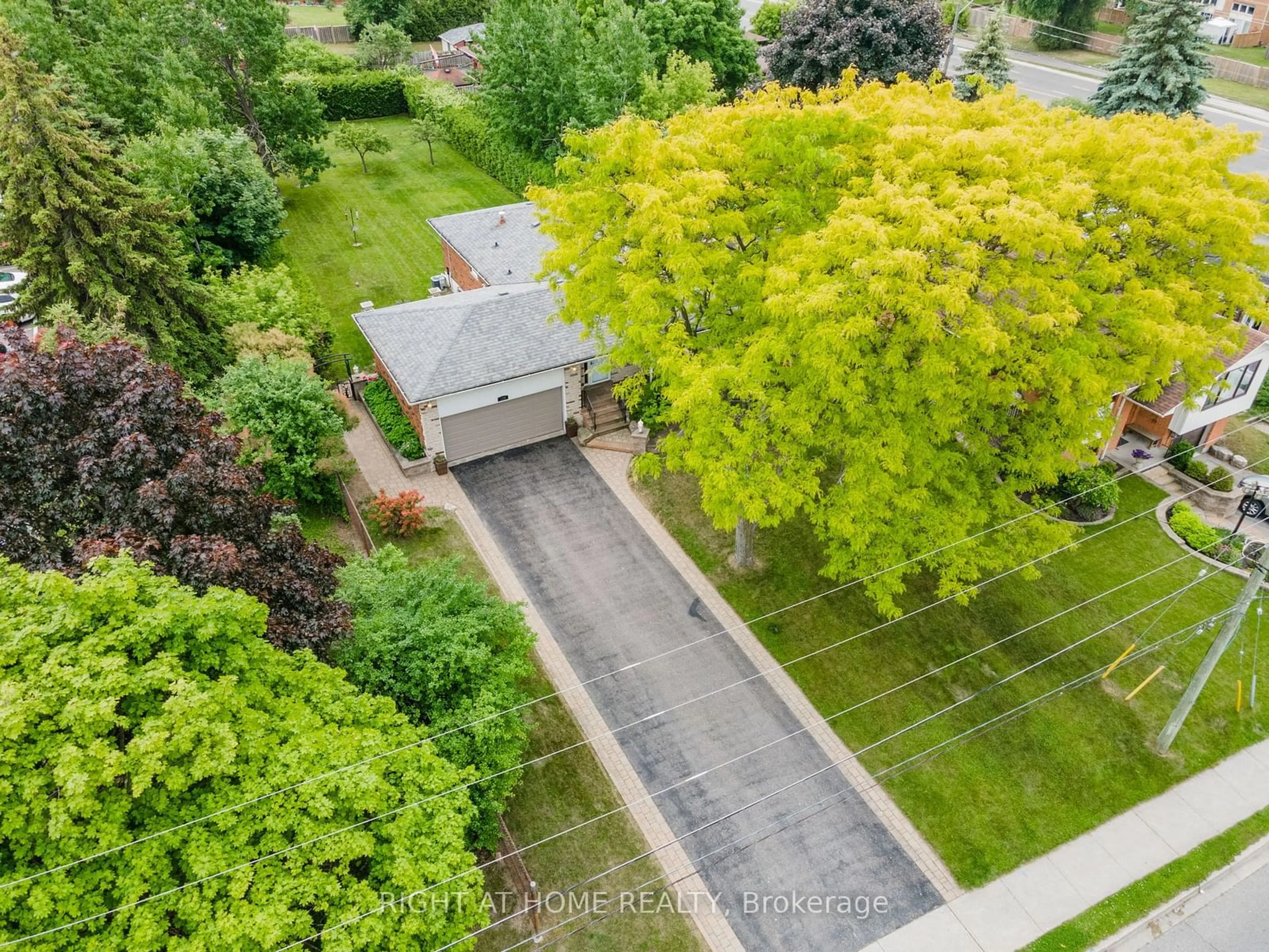 Frontside or backside of a home, the fenced backyard for 109 Crawforth St, Whitby Ontario L1N 3S4