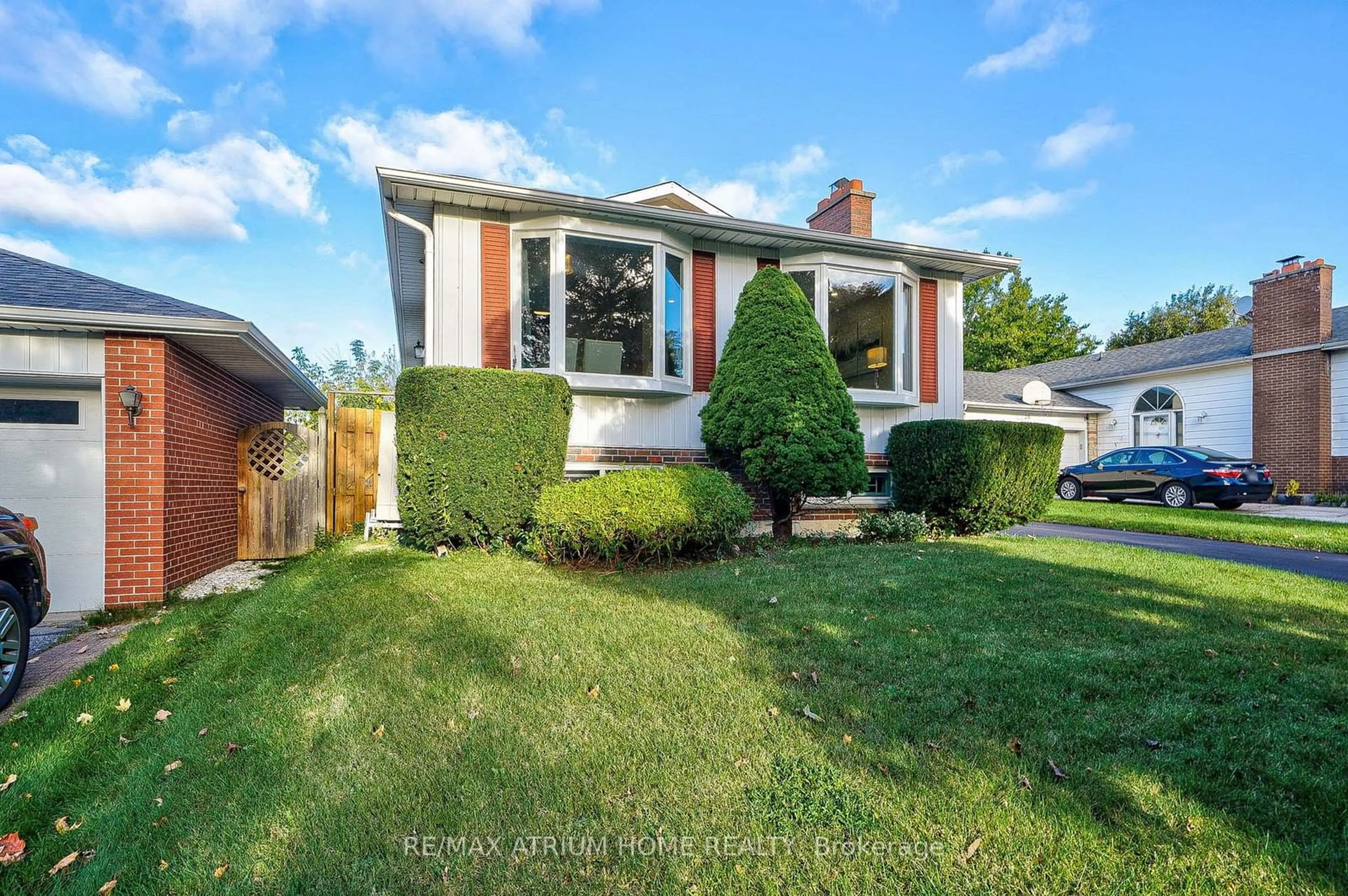 Frontside or backside of a home, the fenced backyard for 18 Castle Hill Dr, Toronto Ontario M1T 2Y3