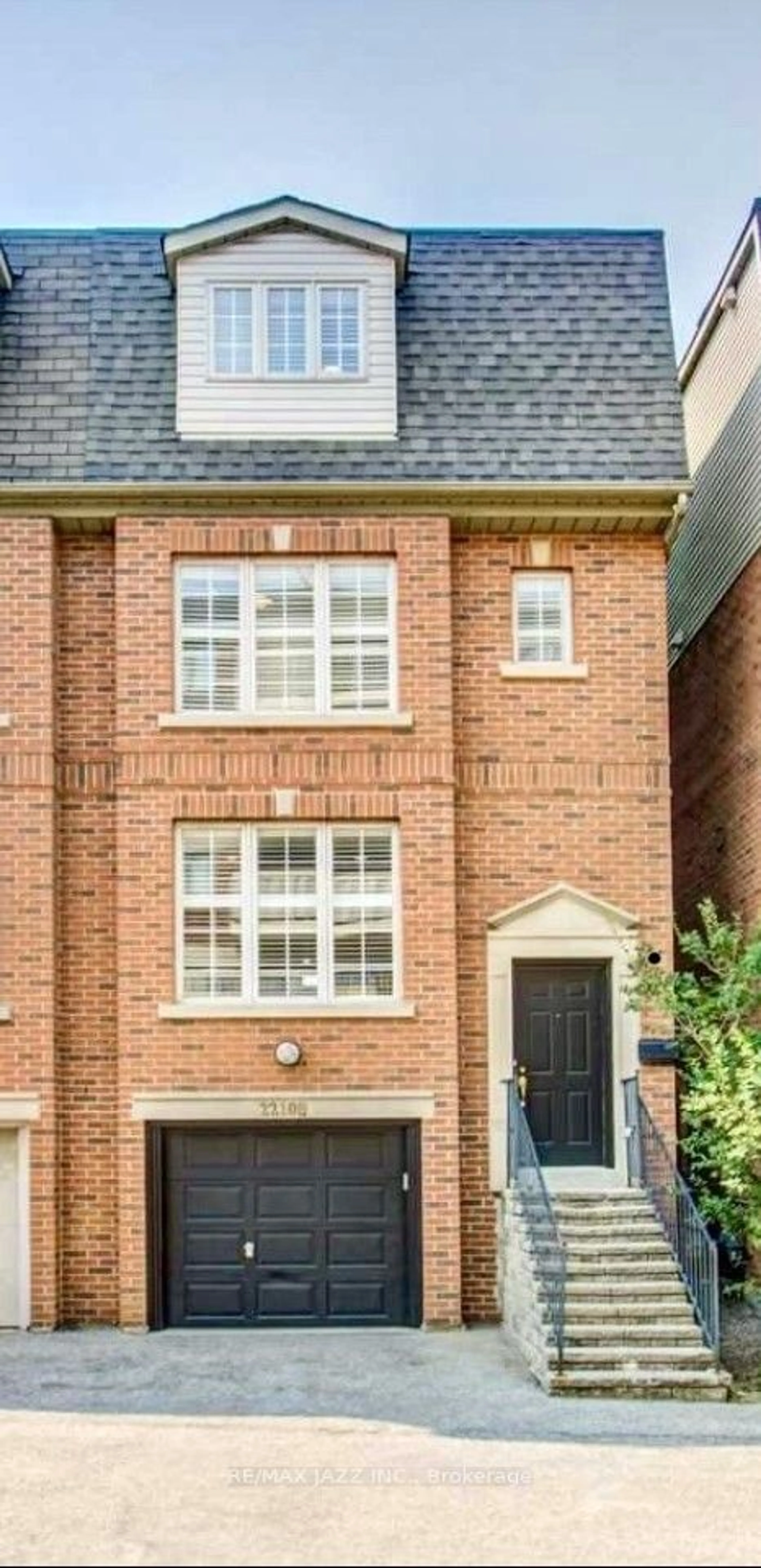 Home with brick exterior material for 2210B Gerrard St, Toronto Ontario M4E 2C7