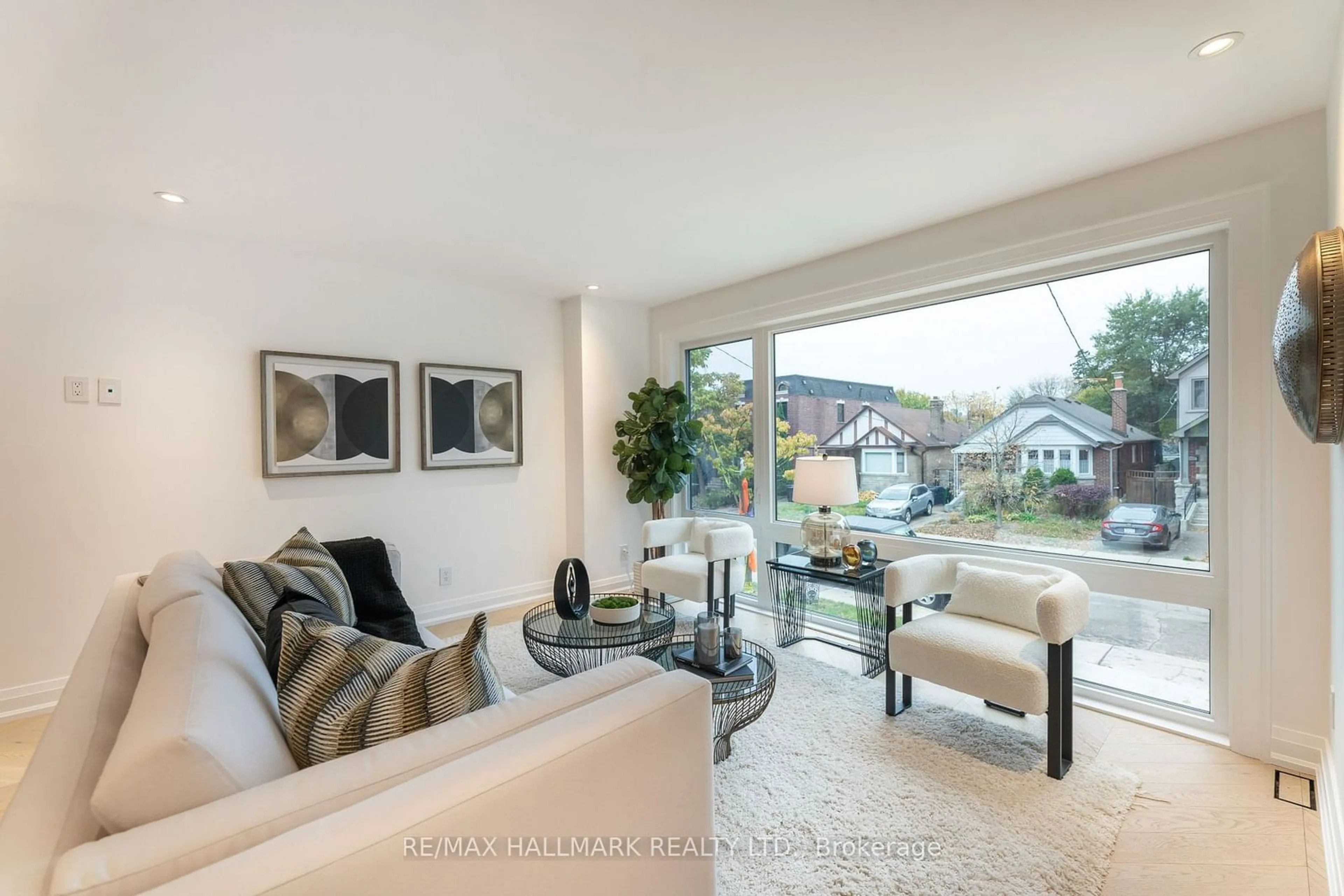 Living room, wood floors for 211 Woodycrest Ave, Toronto Ontario M4J 3C4