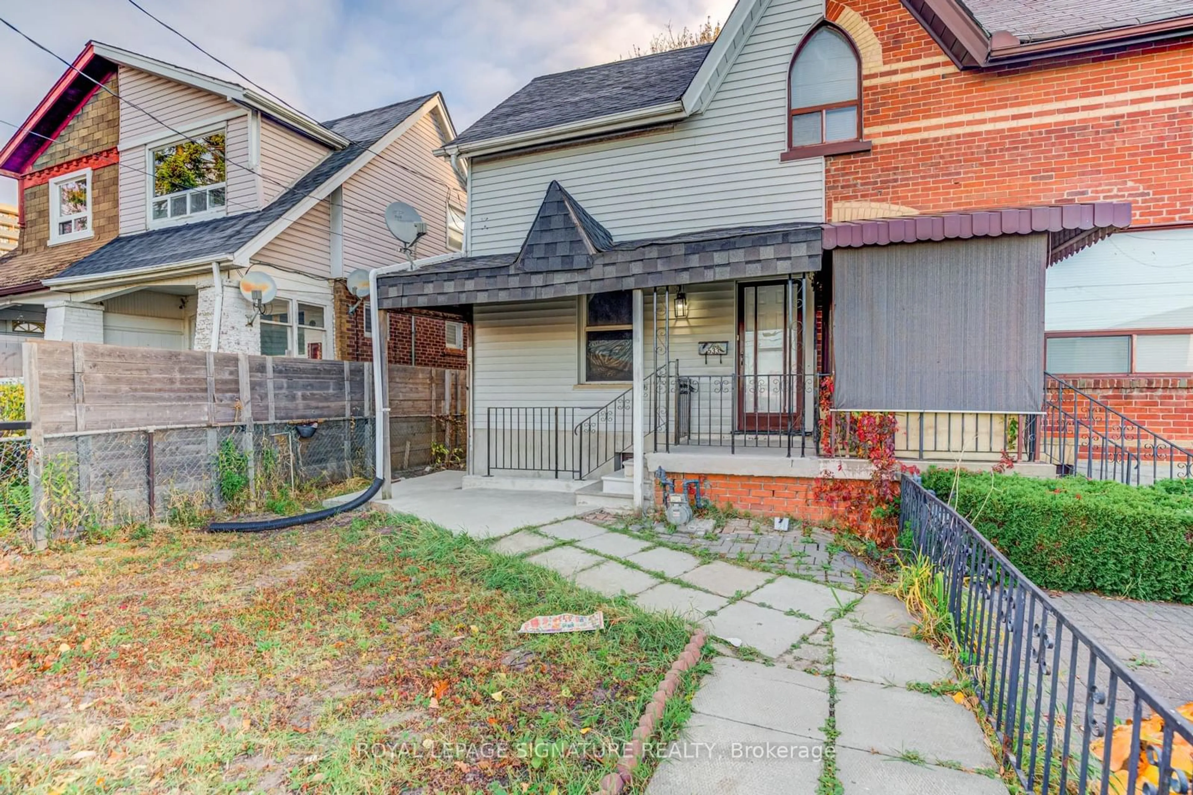 Frontside or backside of a home, the fenced backyard for 533 Victoria Pk Ave, Toronto Ontario M4C 5H2