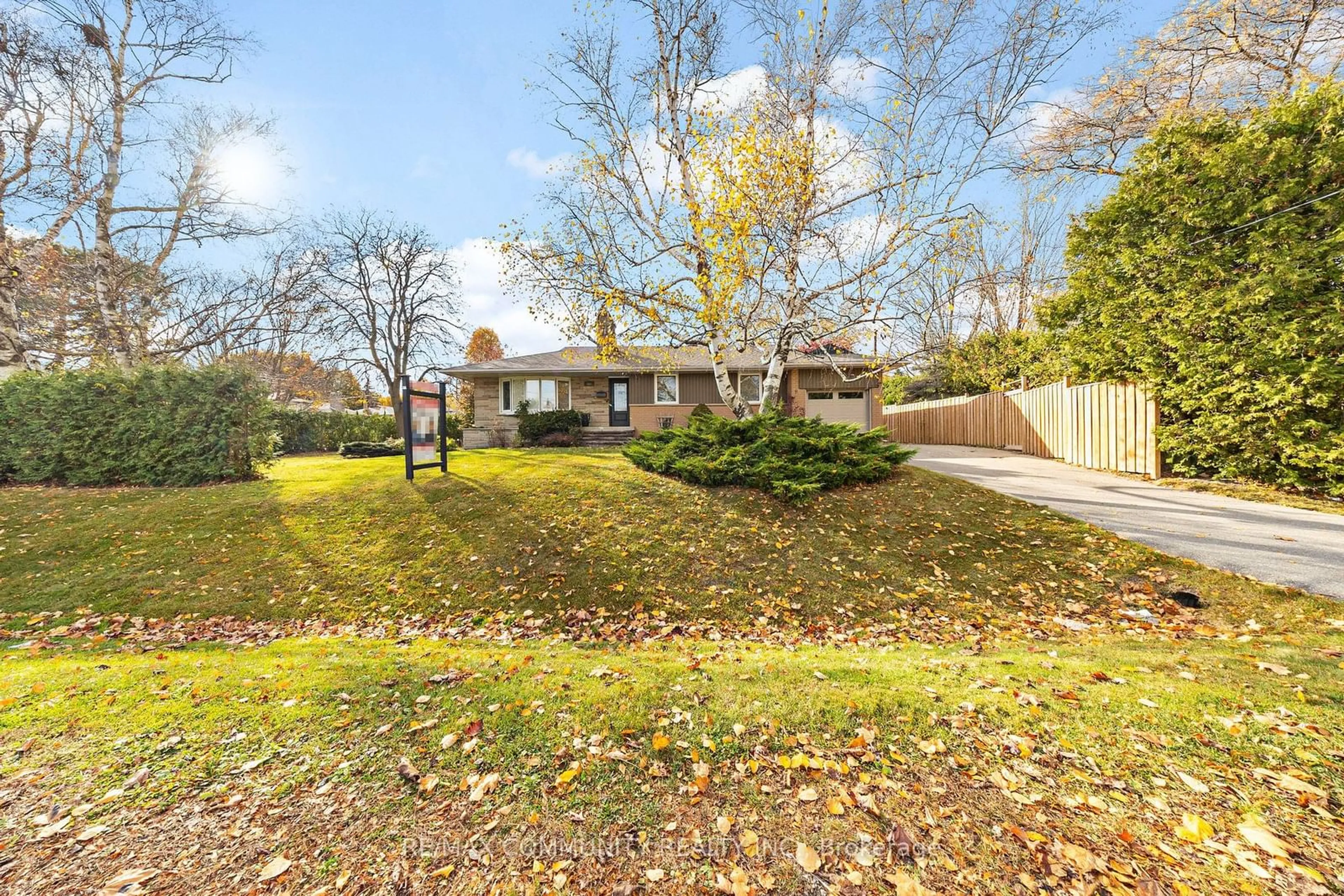 Frontside or backside of a home, the fenced backyard for 310 Friendship Ave, Toronto Ontario M1C 2Y1