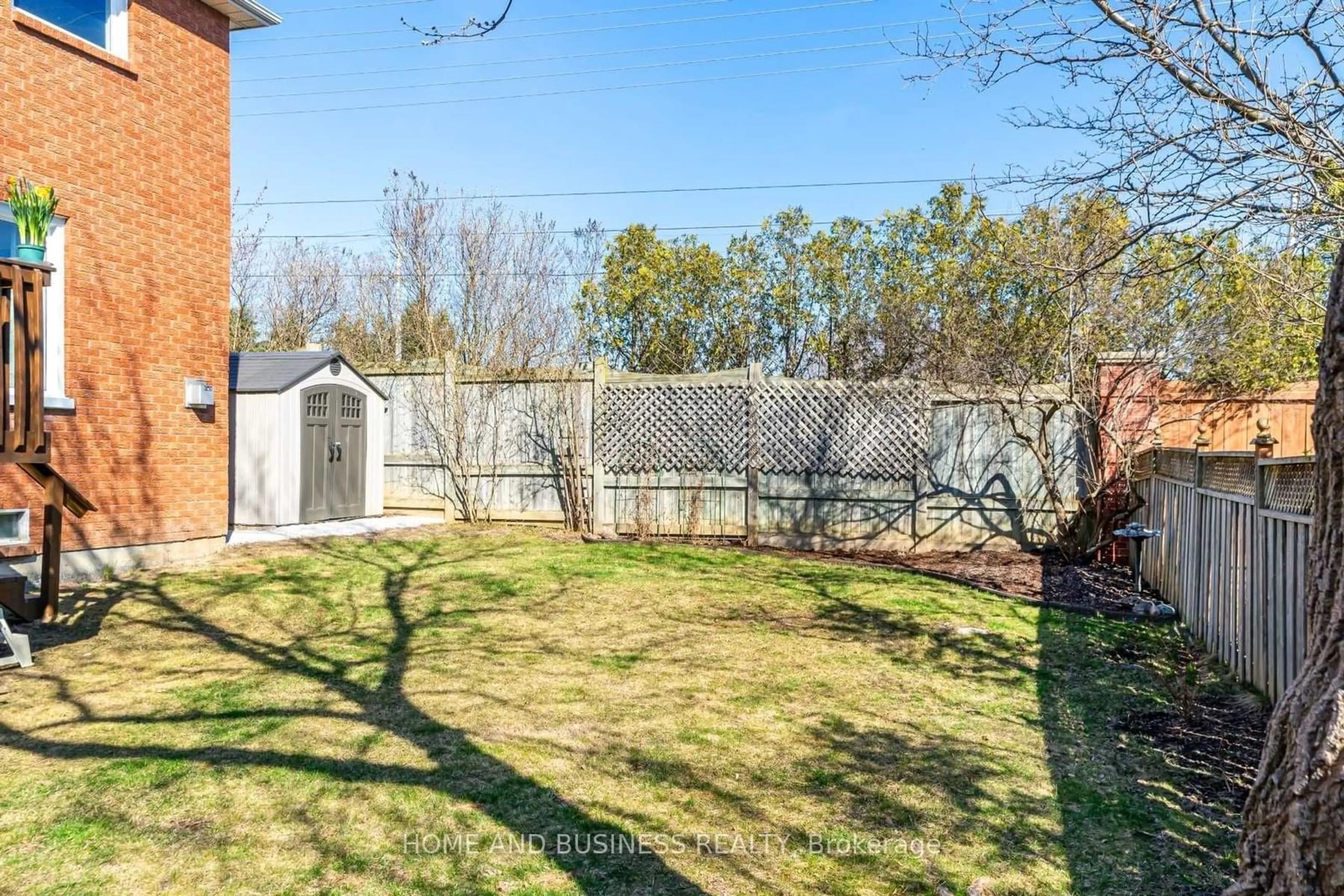 A pic from exterior of the house or condo, the fenced backyard for 9 Shipp Cres, Ajax Ontario L1T 3W6