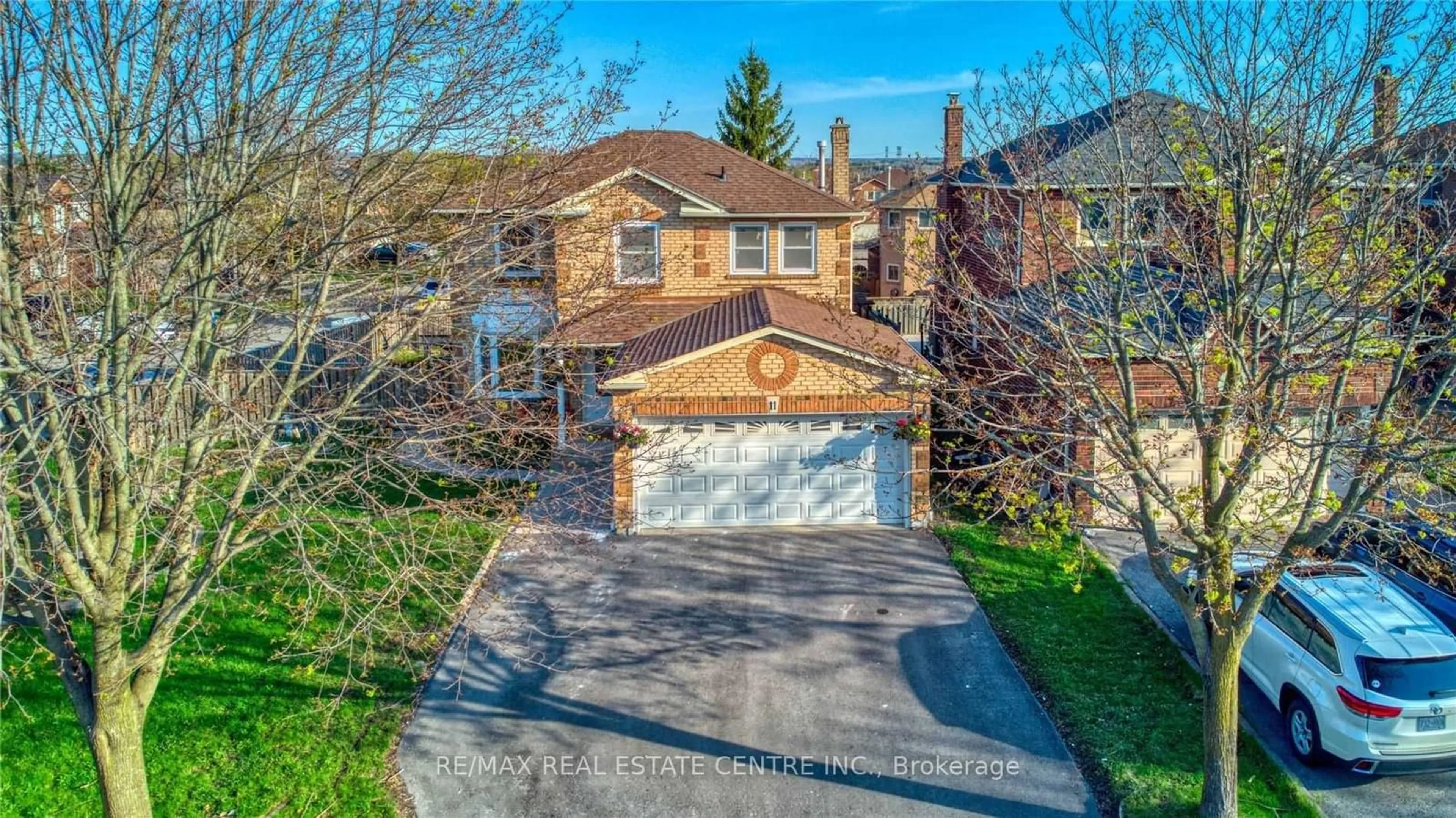 Frontside or backside of a home, the street view for 11 Hunter Dr, Ajax Ontario L1T 3M9