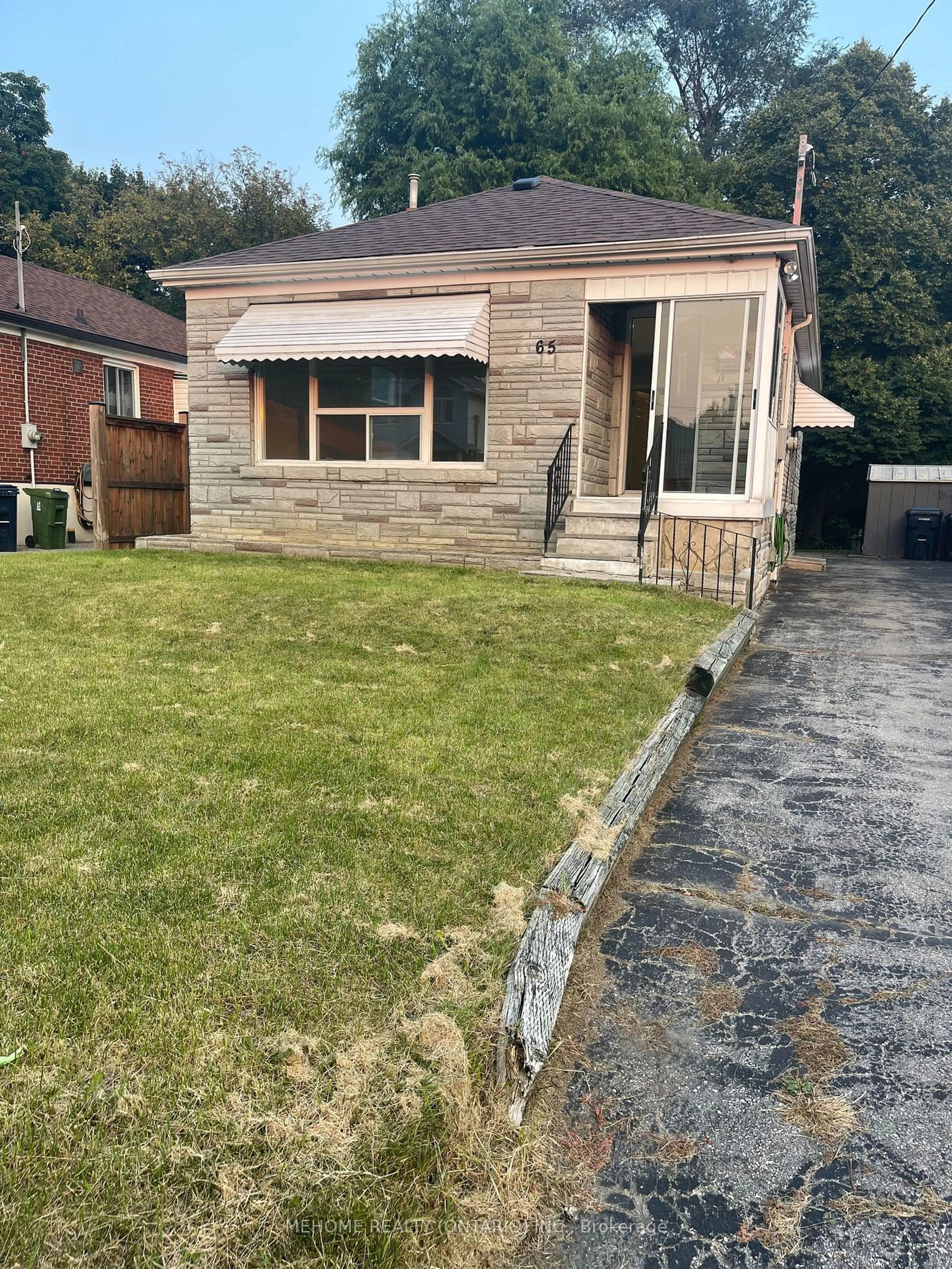 Frontside or backside of a home, the fenced backyard for 65 Miramar Cres, Toronto Ontario M1J 1R3