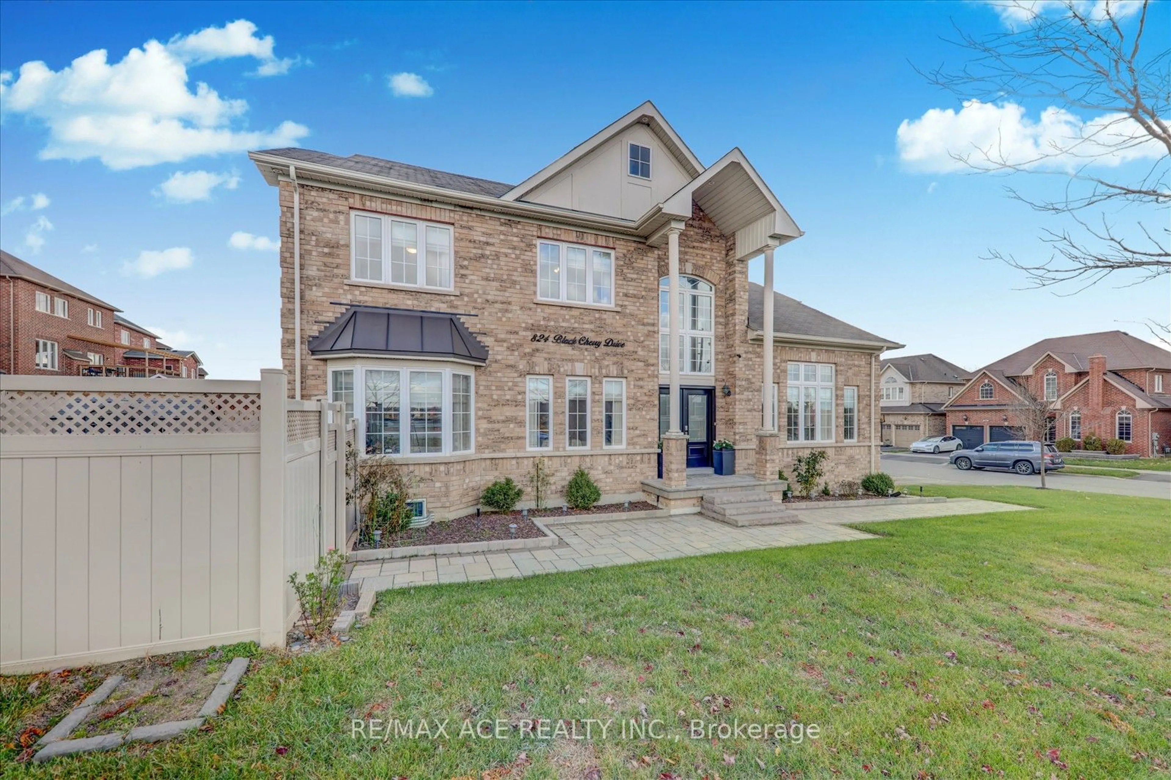 Frontside or backside of a home, the fenced backyard for 824 Black Cherry Dr, Oshawa Ontario L1K 0P5