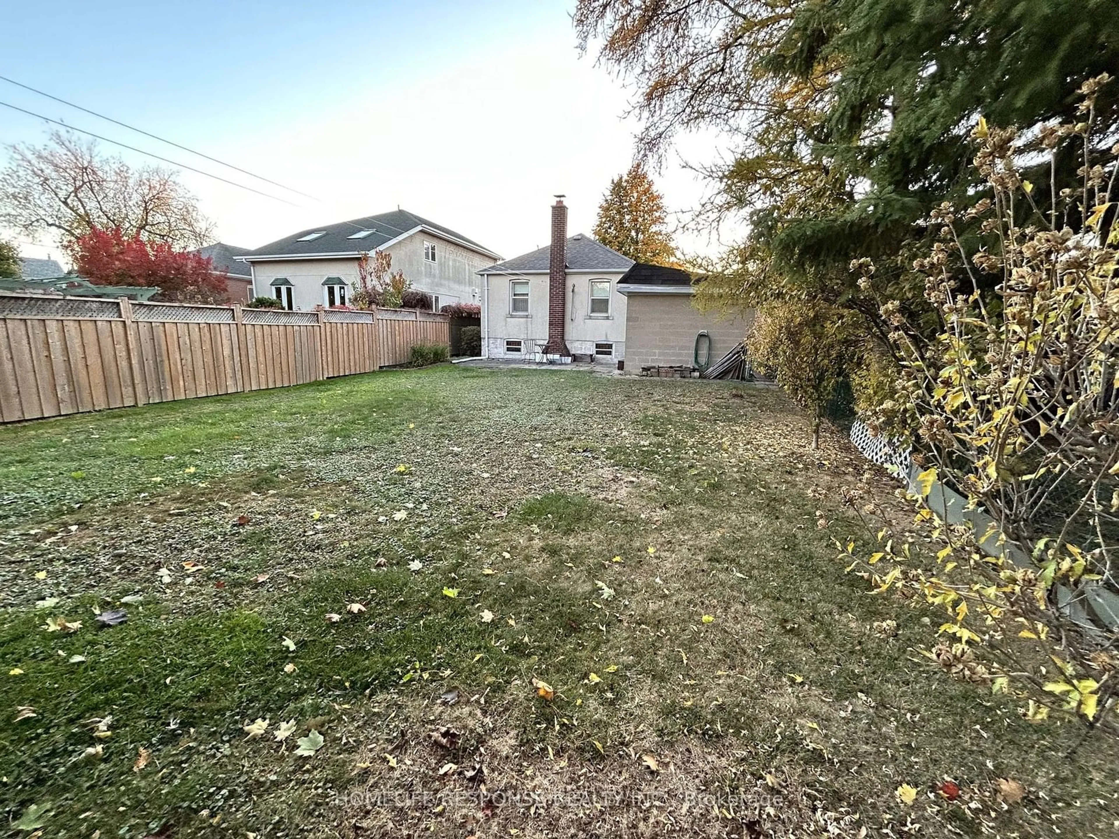 Frontside or backside of a home, the fenced backyard for 11 Arden Cres, Toronto Ontario M1L 3R6