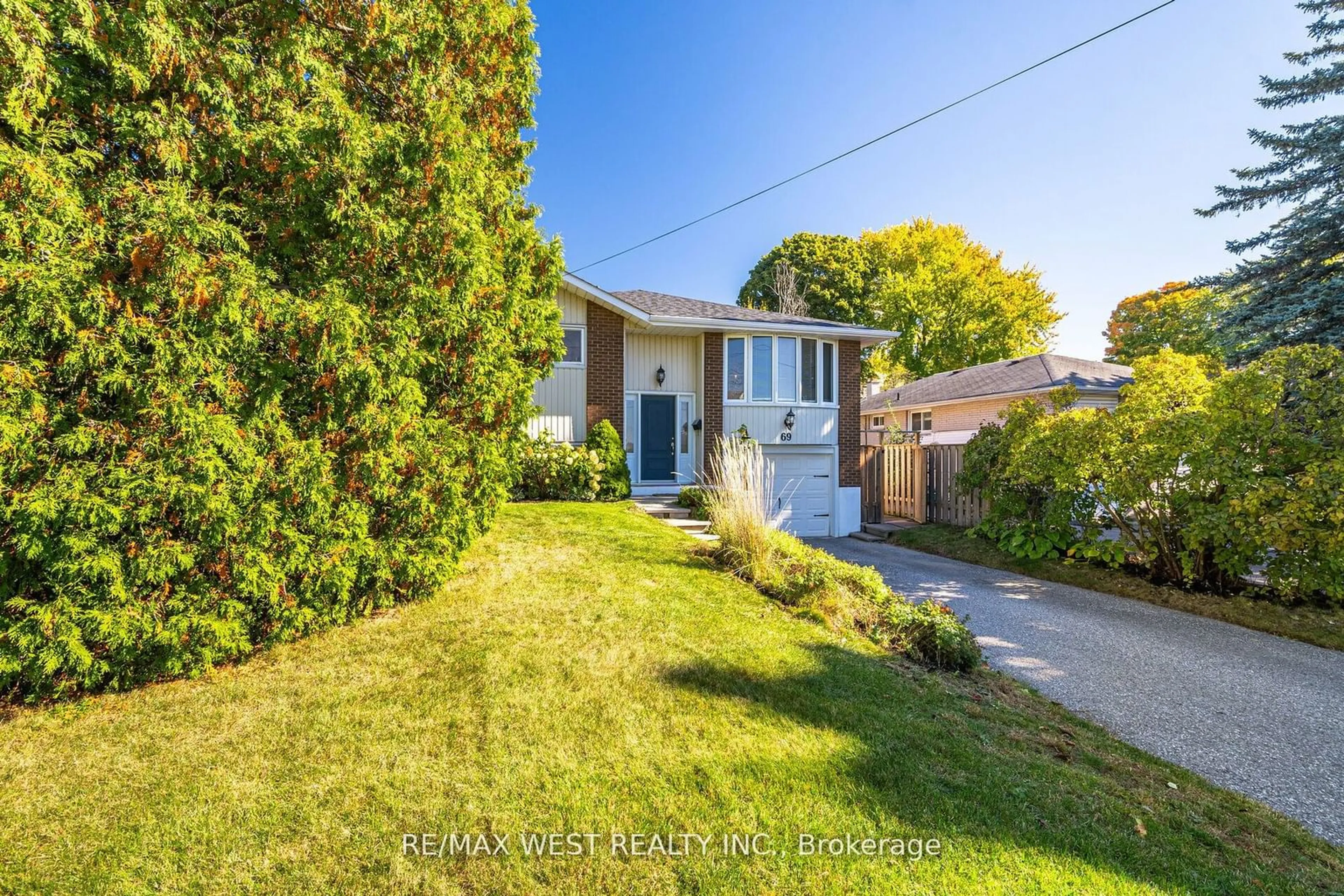 Frontside or backside of a home, the fenced backyard for 69 Keewatin St S, Oshawa Ontario L1H 6Z2