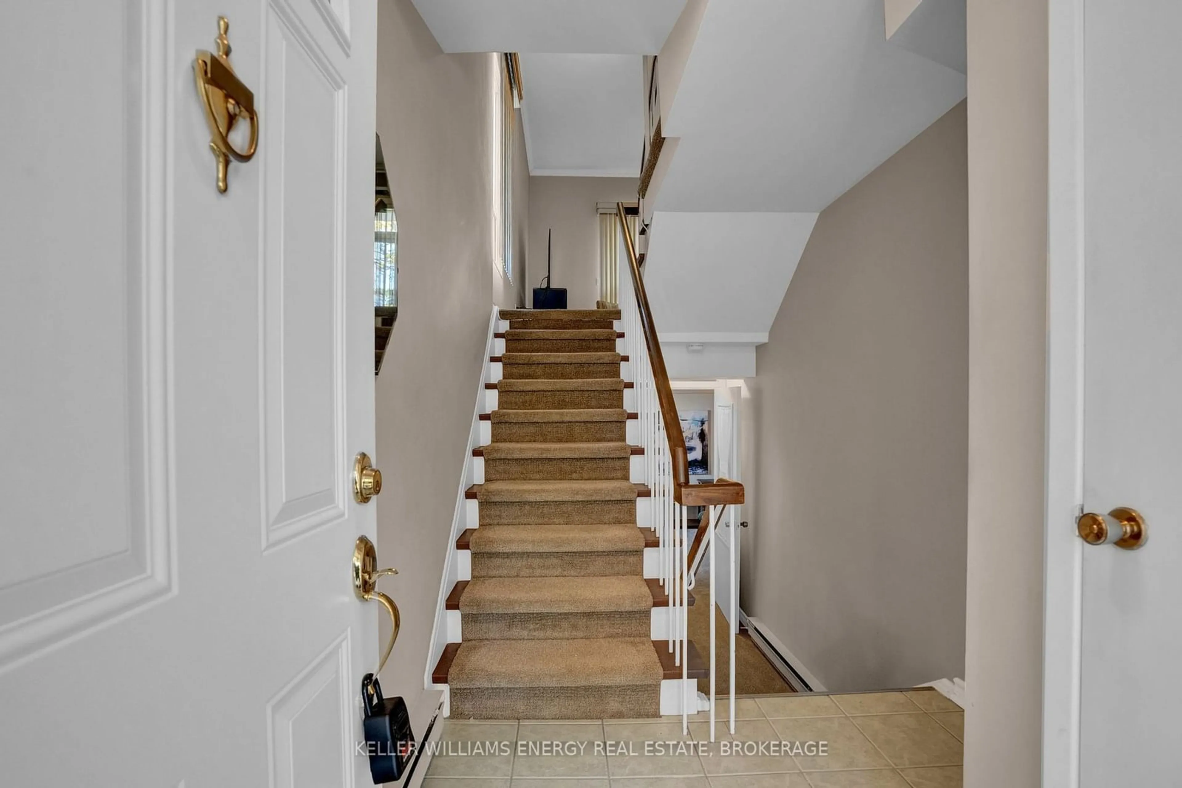 Indoor foyer, wood floors for 3409 St Clair Ave #24, Toronto Ontario M1L 1W3