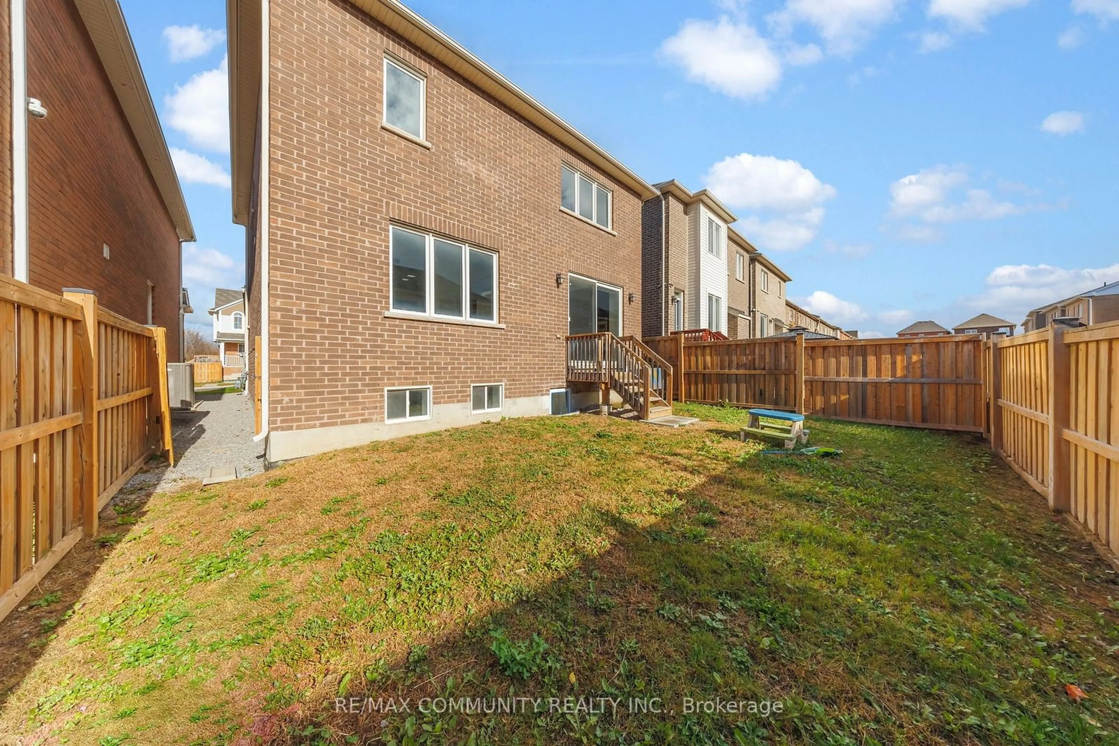 Frontside or backside of a home, the fenced backyard for 1009 Dragonfly Ave, Pickering Ontario L1V 2P8