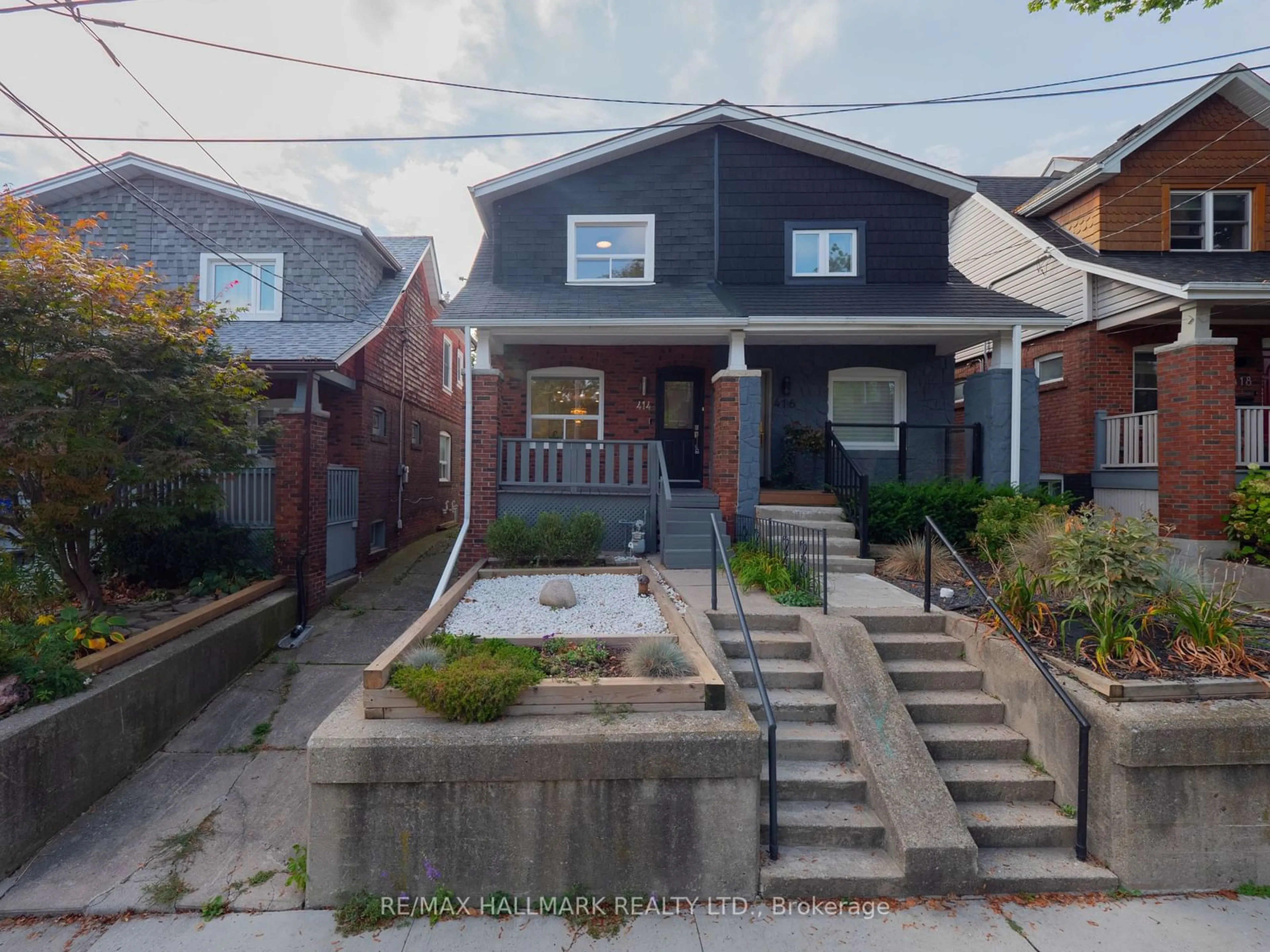 Frontside or backside of a home, the street view for 414 Jones Ave, Toronto Ontario M4J 3G3