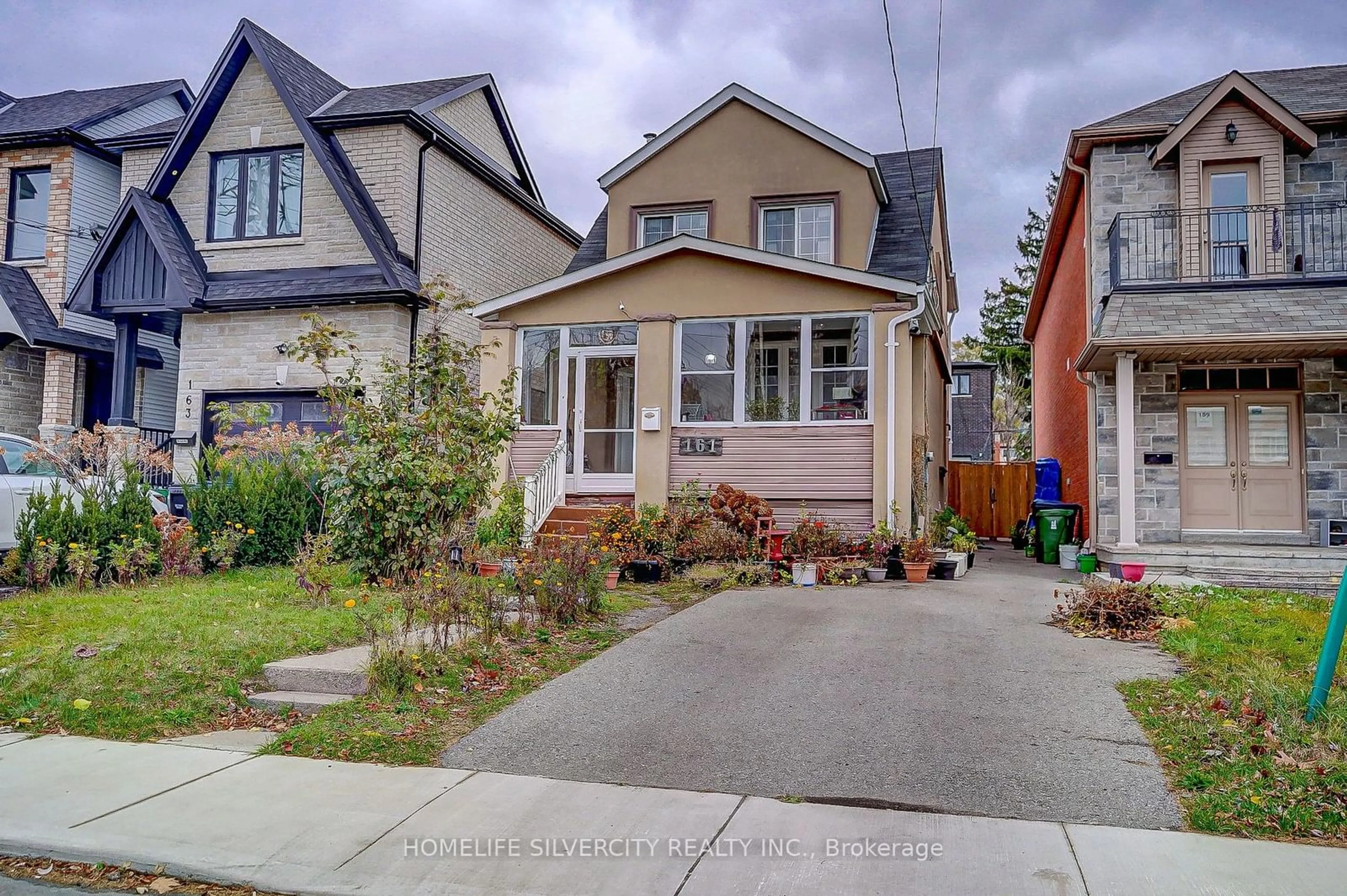 Frontside or backside of a home, the street view for 161 August Ave, Toronto Ontario M1L 3N3