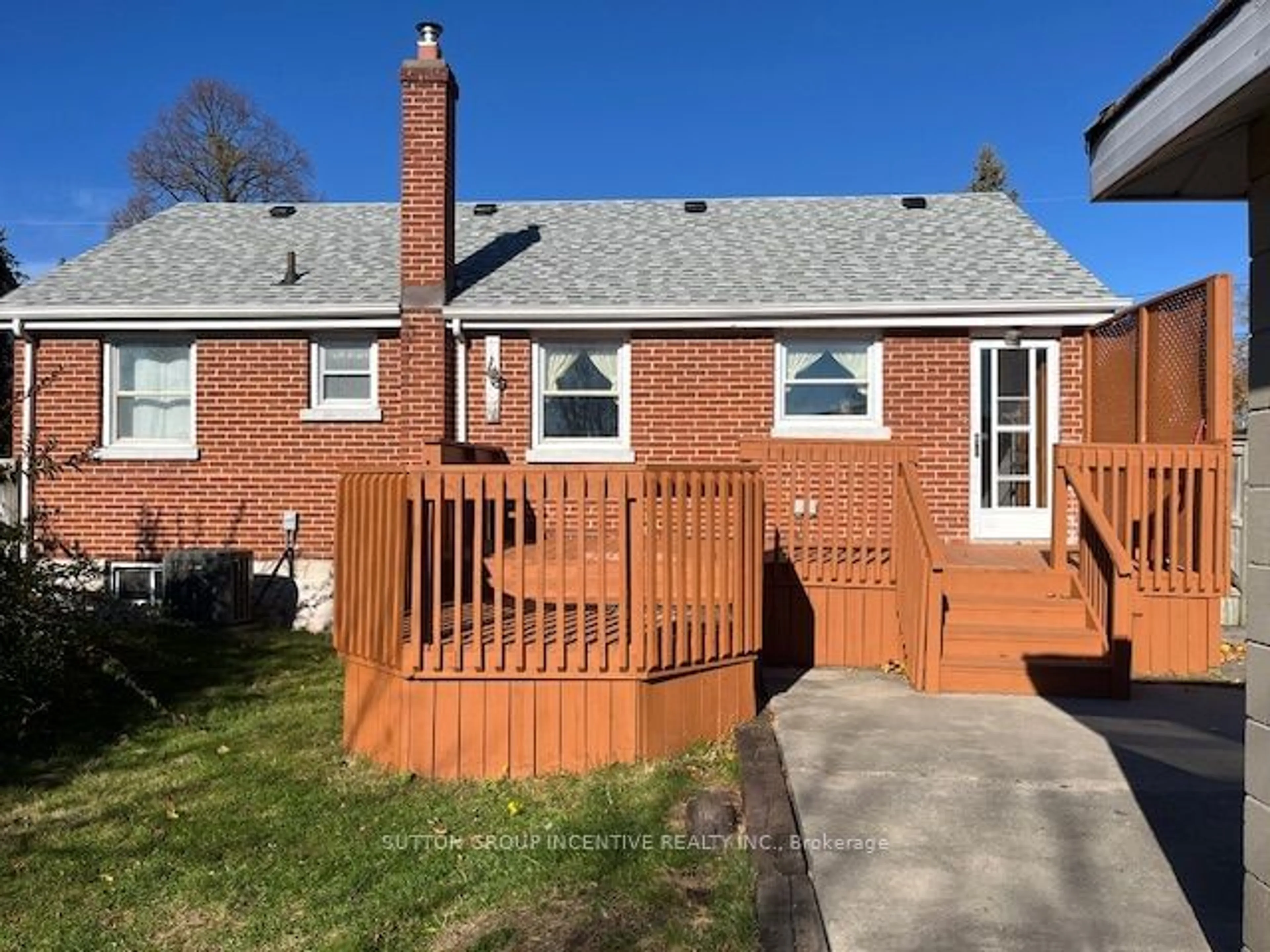 Frontside or backside of a home, the fenced backyard for 75 Kawartha Ave, Oshawa Ontario L1H 3Y7