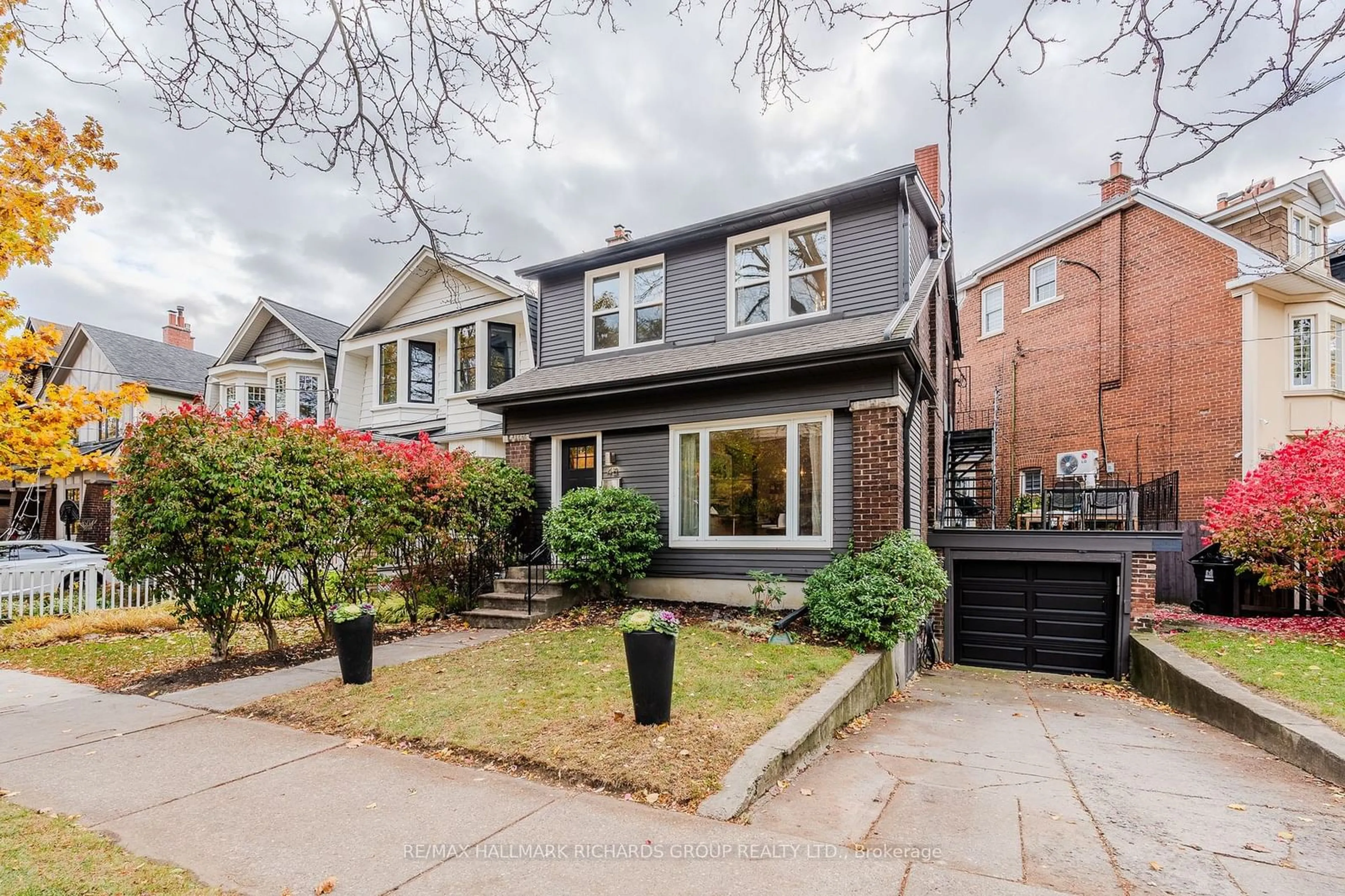 Frontside or backside of a home, the street view for 48 Lockwood Rd, Toronto Ontario M4L 3M8