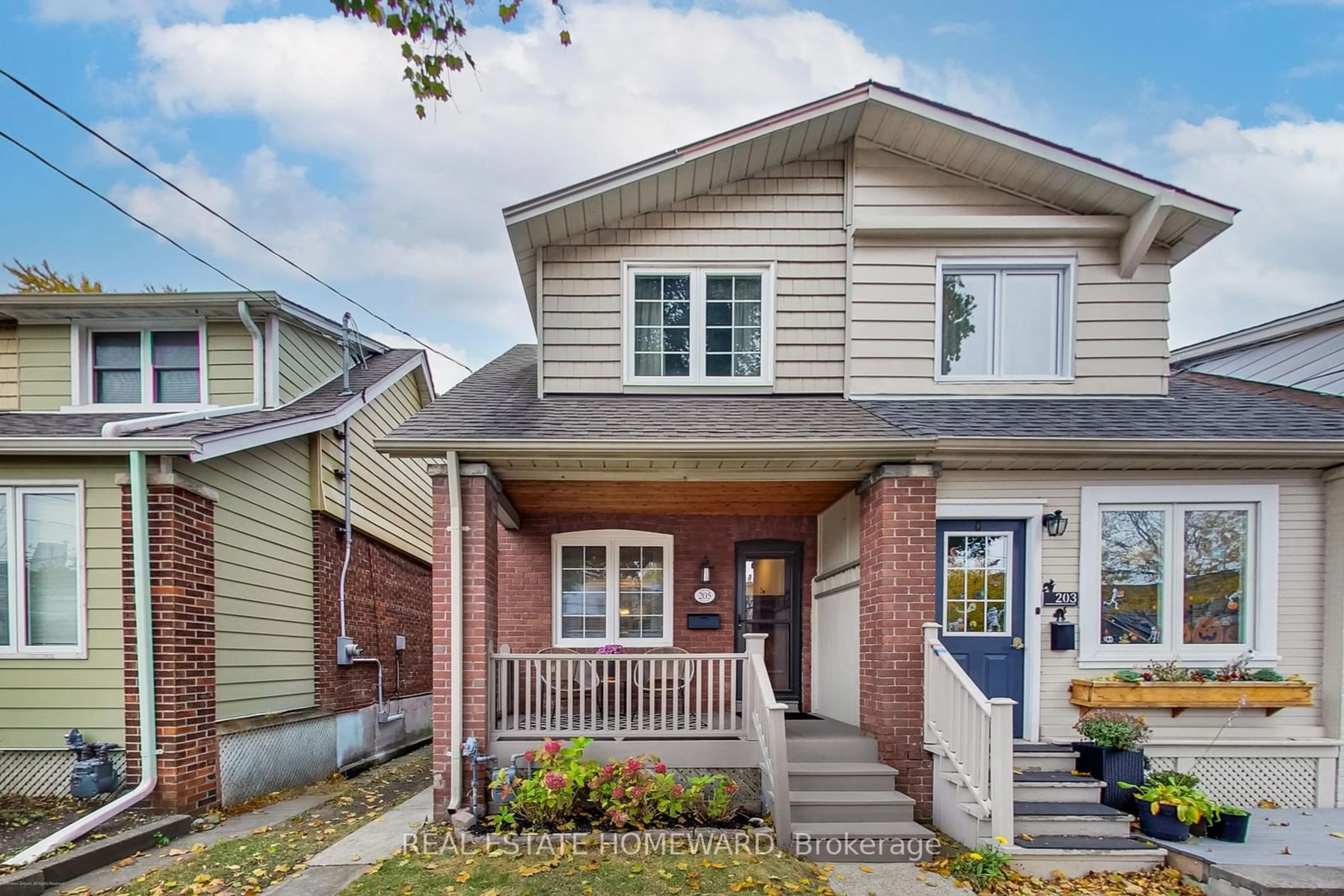 Frontside or backside of a home, cottage for 205 Lawlor Ave, Toronto Ontario M4E 3L9