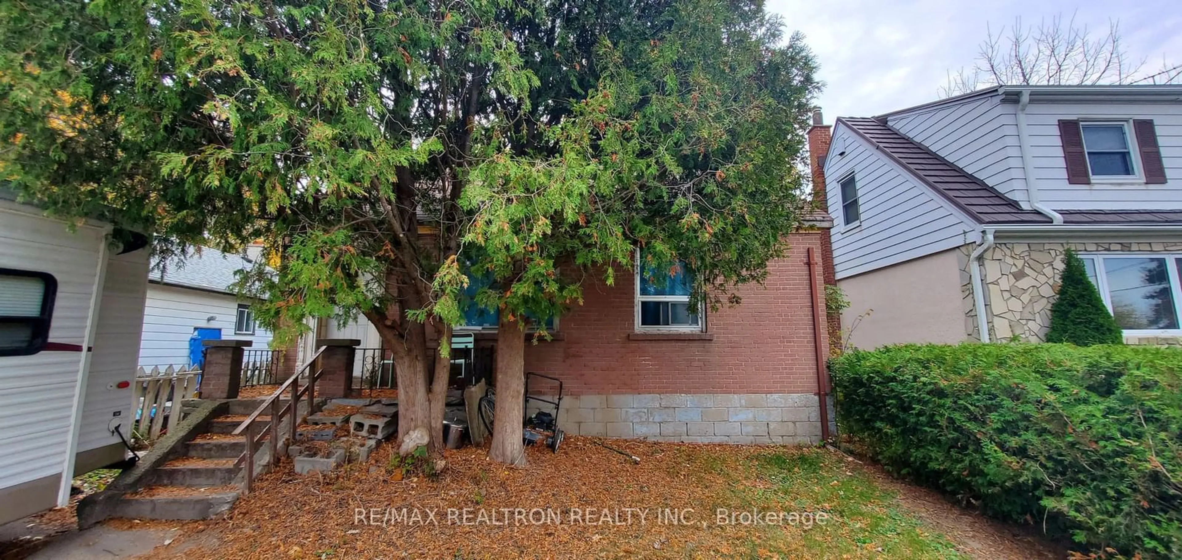 Frontside or backside of a home, the fenced backyard for 101 Harewood Ave, Toronto Ontario M1M 2R4