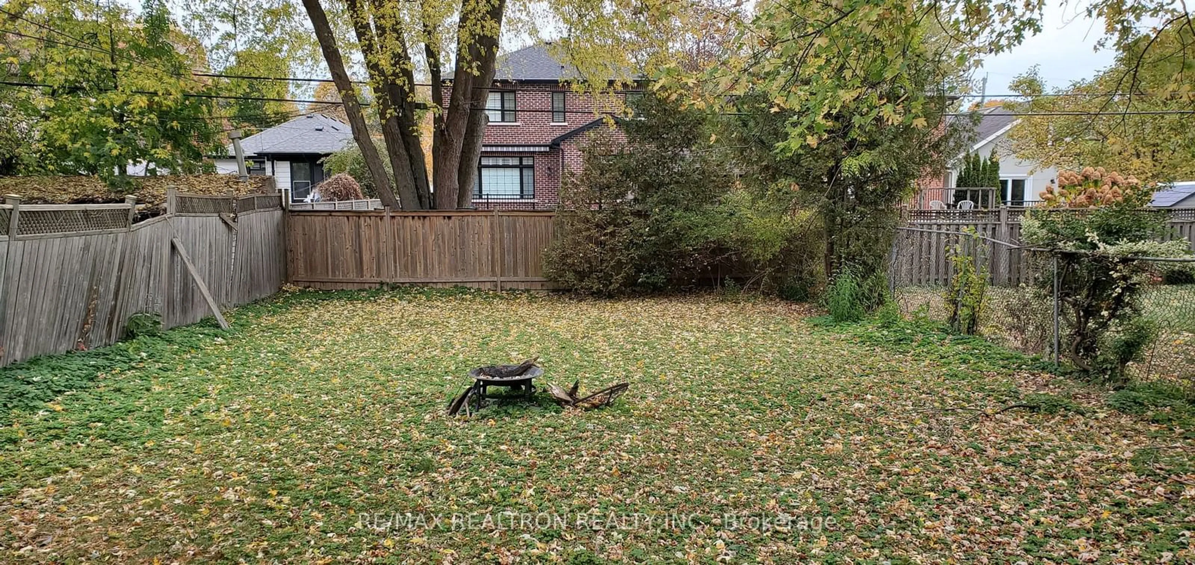 Frontside or backside of a home, the fenced backyard for 101 Harewood Ave, Toronto Ontario M1M 2R4