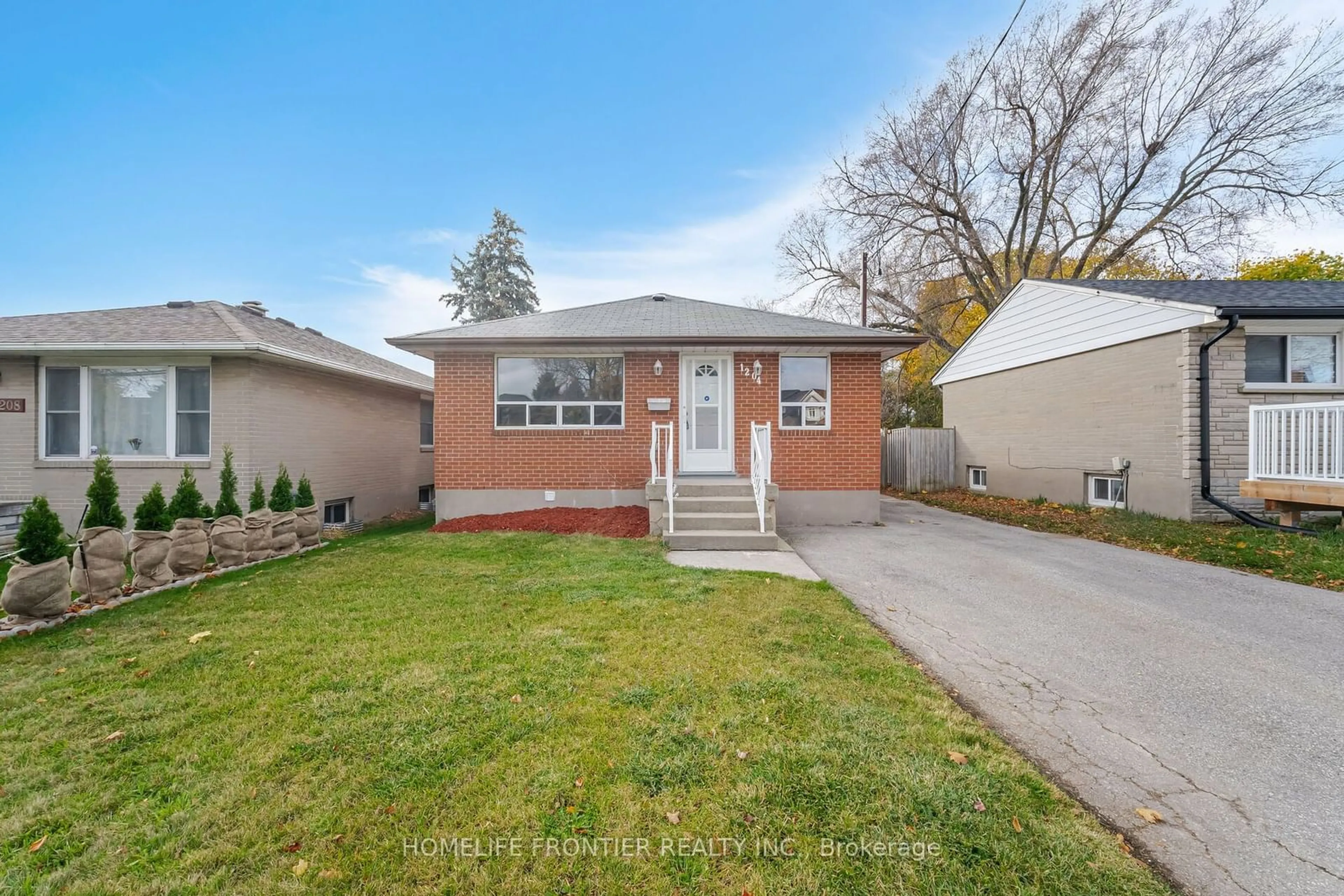 Frontside or backside of a home, the fenced backyard for 1204 Simcoe St, Oshawa Ontario L1H 4M2