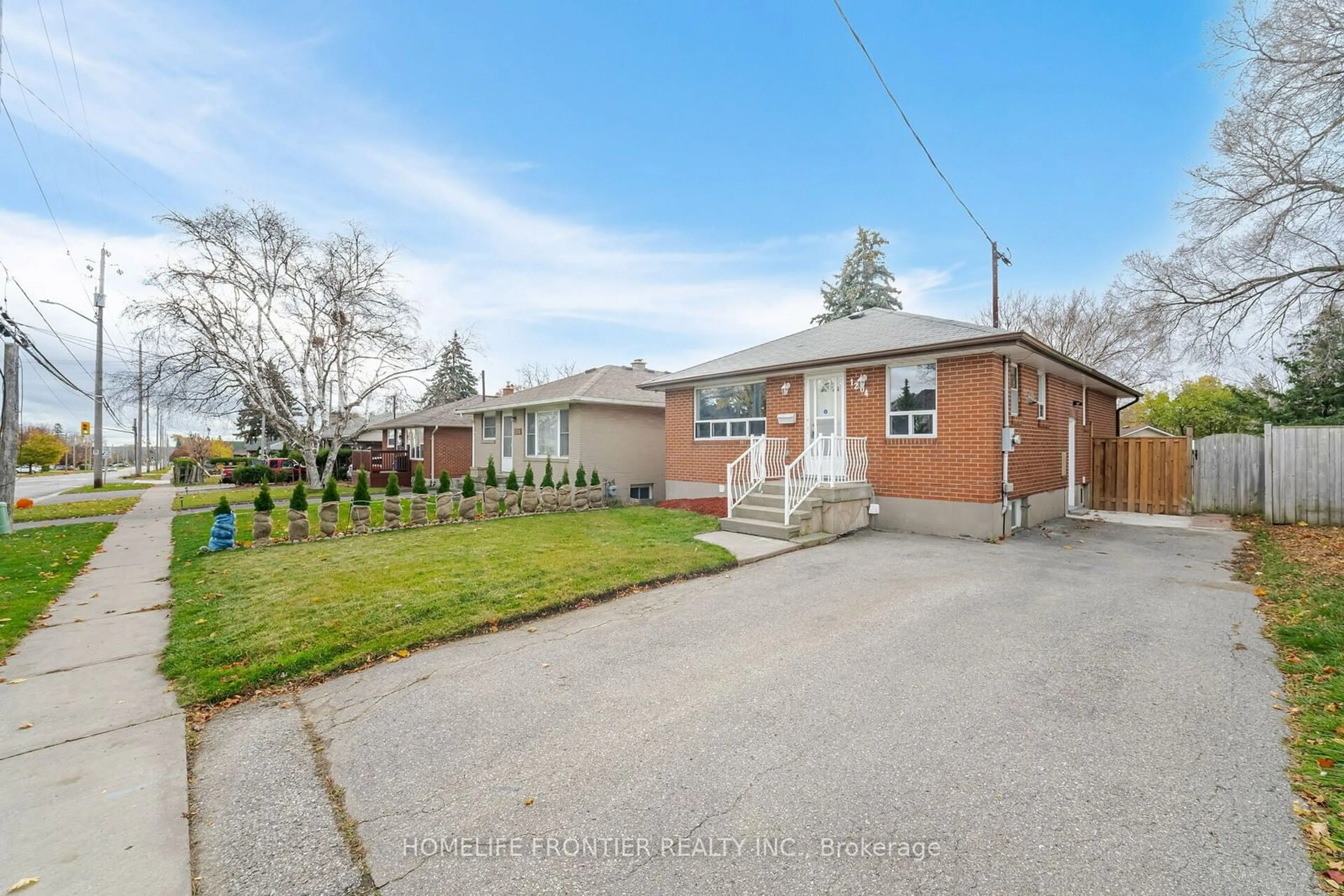 Frontside or backside of a home, the fenced backyard for 1204 Simcoe St, Oshawa Ontario L1H 4M2