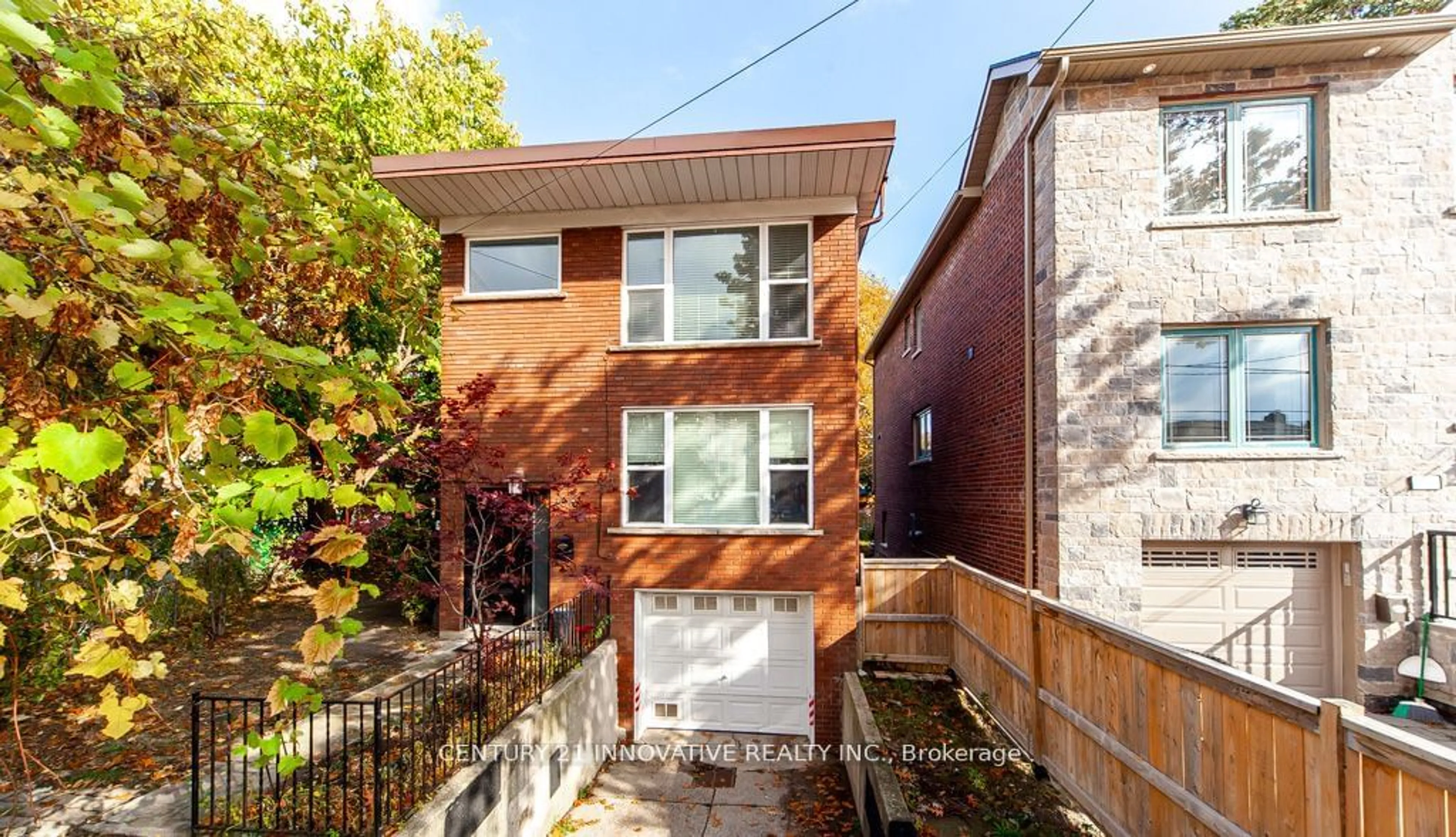 A pic from exterior of the house or condo, the fenced backyard for 135 Queensbury Ave, Toronto Ontario M1N 2X8