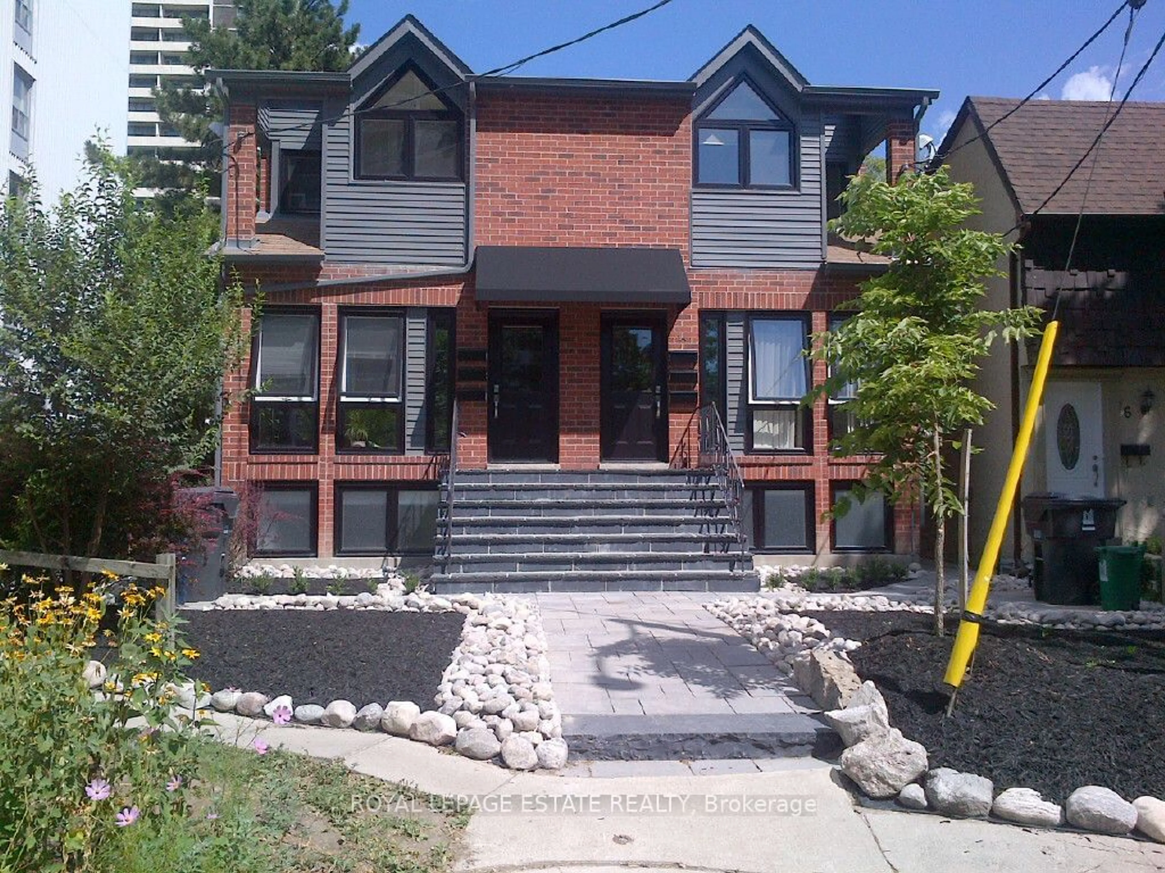 Home with brick exterior material for 12-14 Dartford Rd, Toronto Ontario M4K 1S8