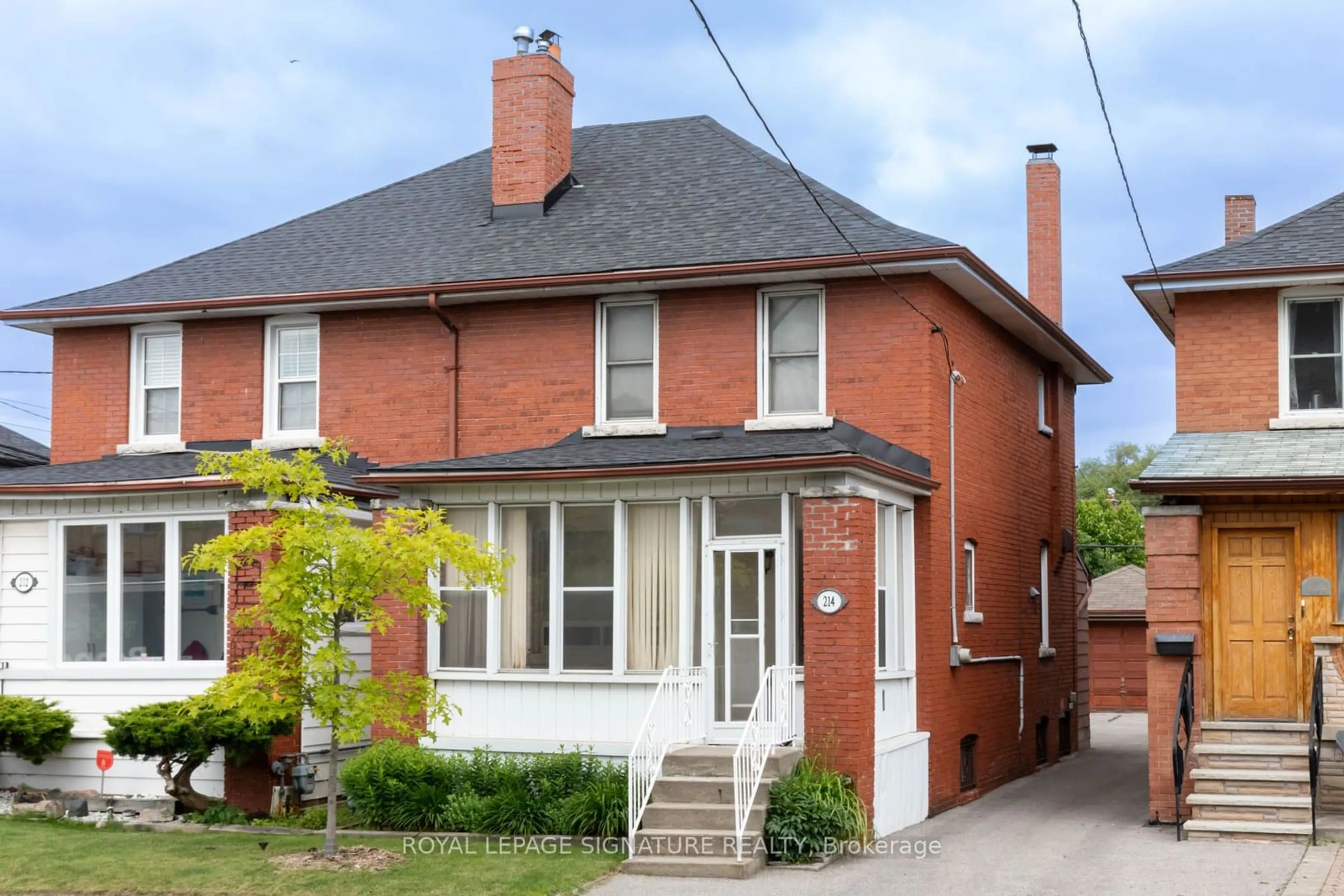 Home with brick exterior material for 214 Mortimer Ave, Toronto Ontario M4J 2C5