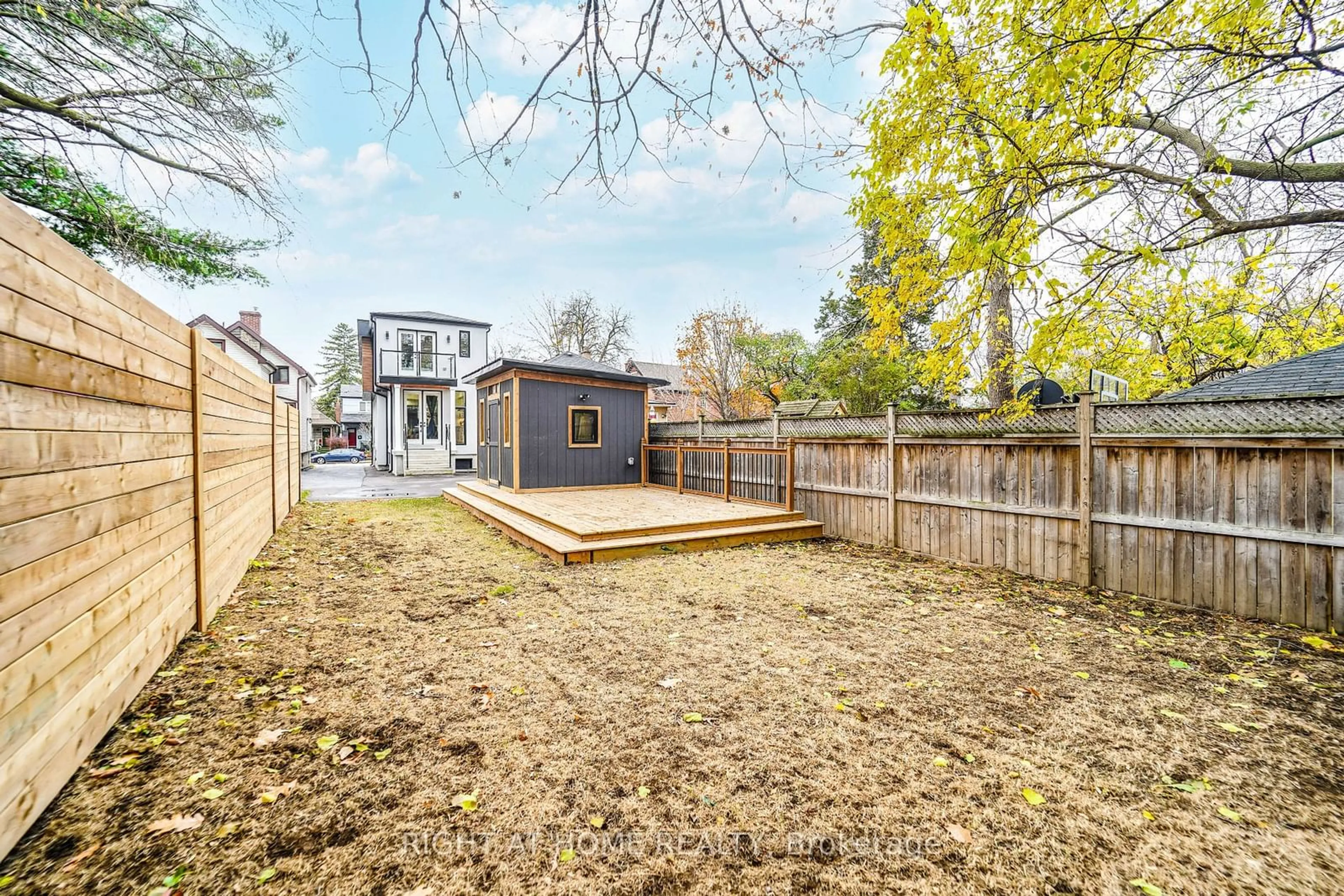 Patio, the fenced backyard for 201 Gledhill Ave, Toronto Ontario M4C 5K9