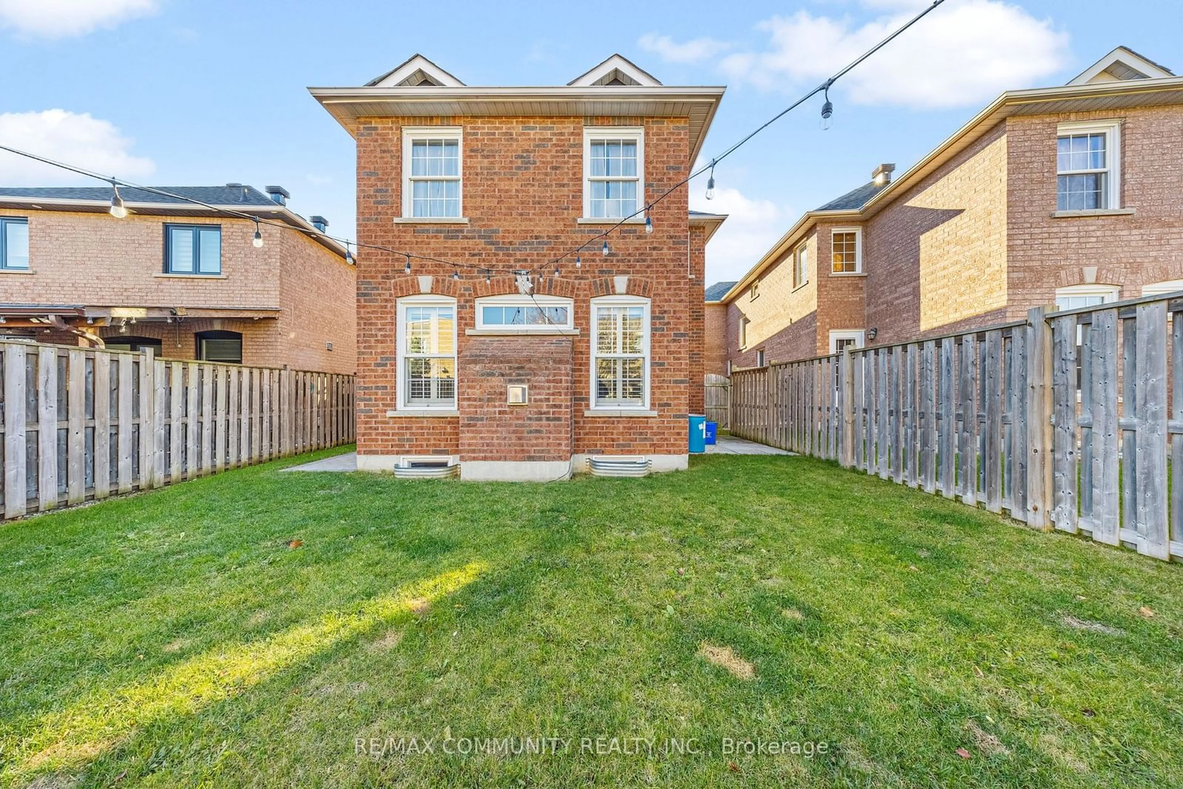 A pic from exterior of the house or condo, the fenced backyard for 11 Searell Ave, Ajax Ontario L1T 4Z6