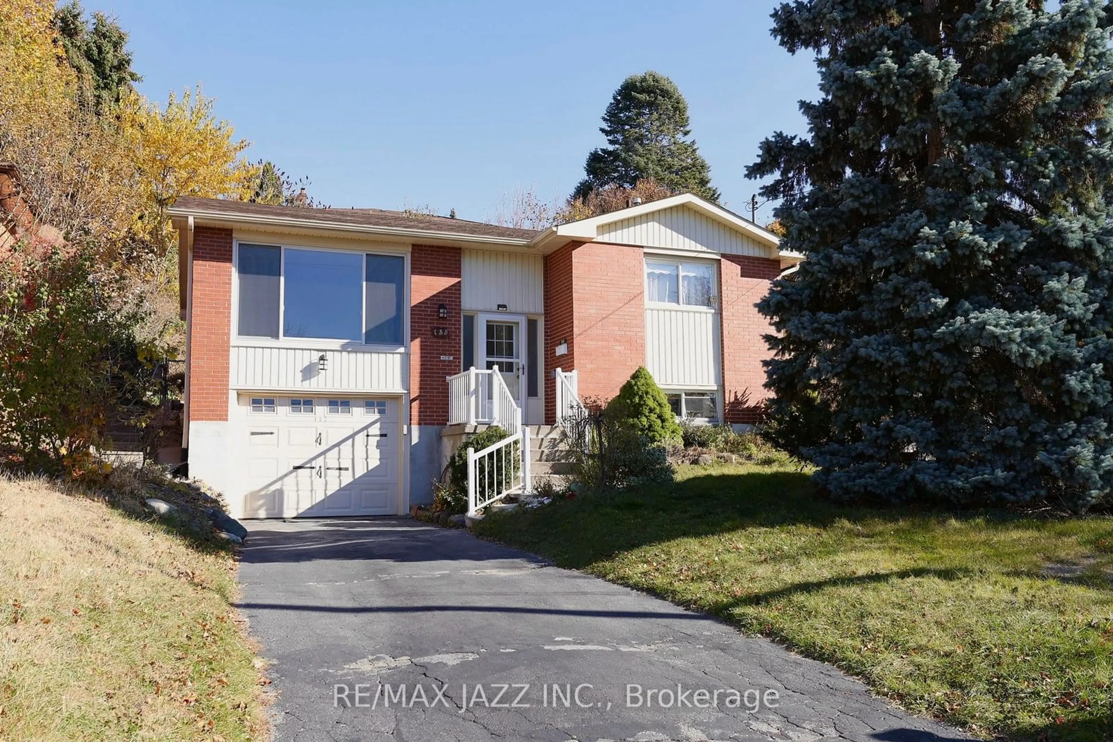 Frontside or backside of a home, the fenced backyard for 135 Springdale Cres, Oshawa Ontario L1H 7B9