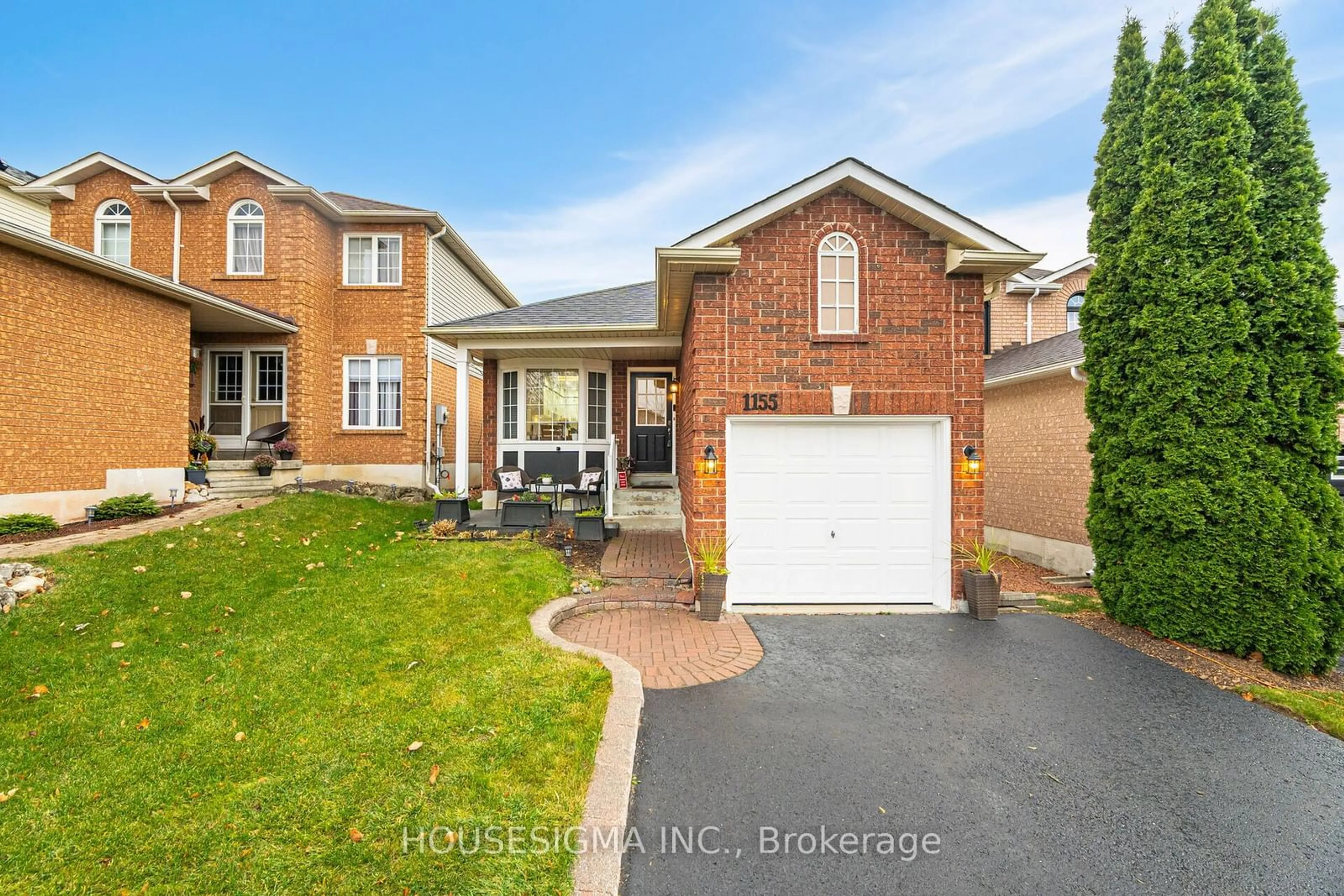 Frontside or backside of a home, the fenced backyard for 1155 Ridgemount Blvd, Oshawa Ontario L1K 2L2