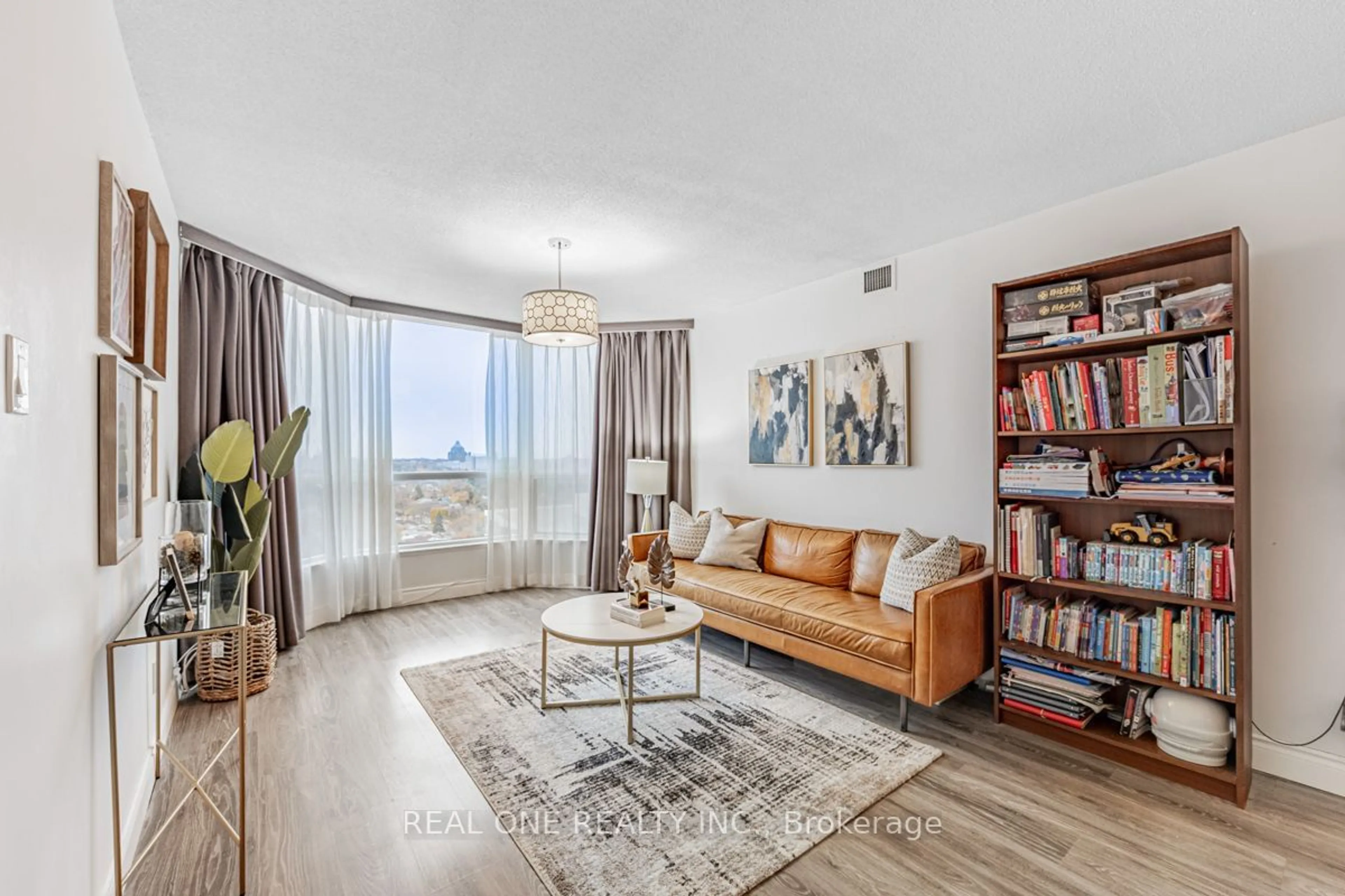 Living room, wood floors for 4725 Sheppard Ave #1915, Toronto Ontario M1S 5B2