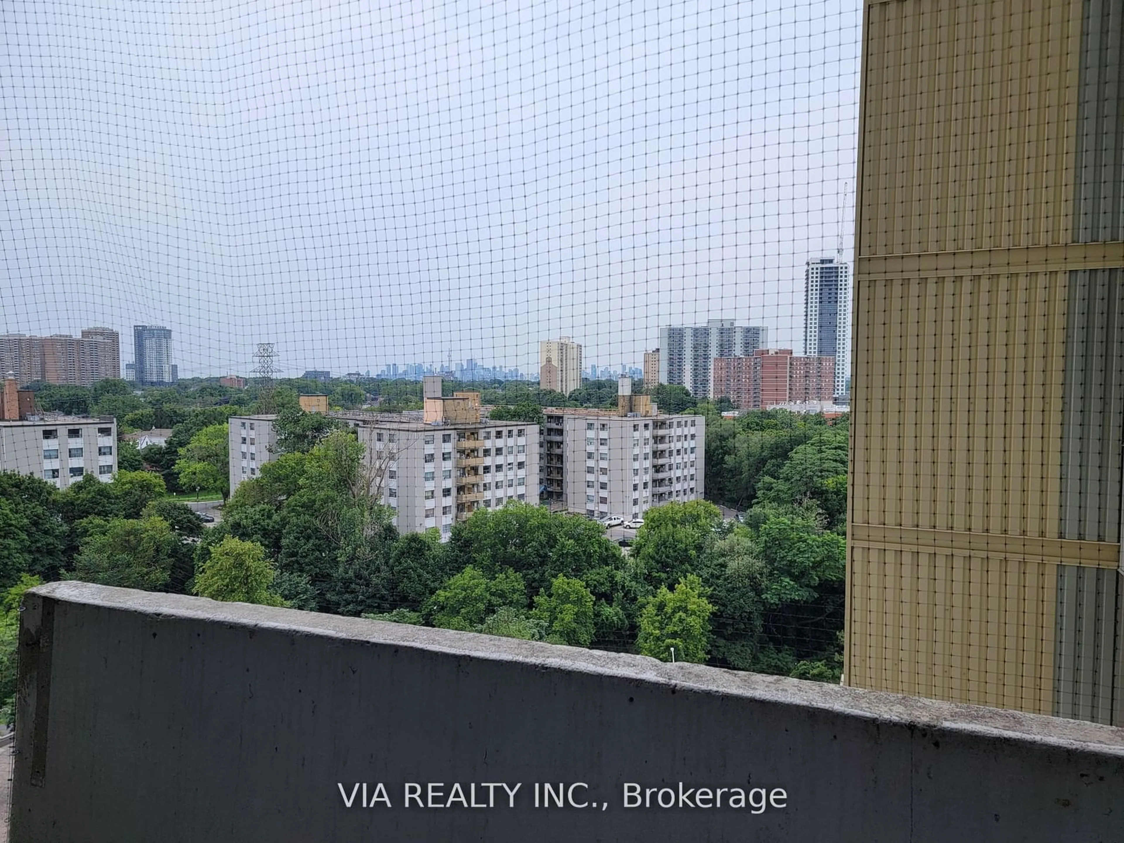 Balcony in the apartment, the view of city buildings for 1 Massey Sq #1109, Toronto Ontario M4C 5L4