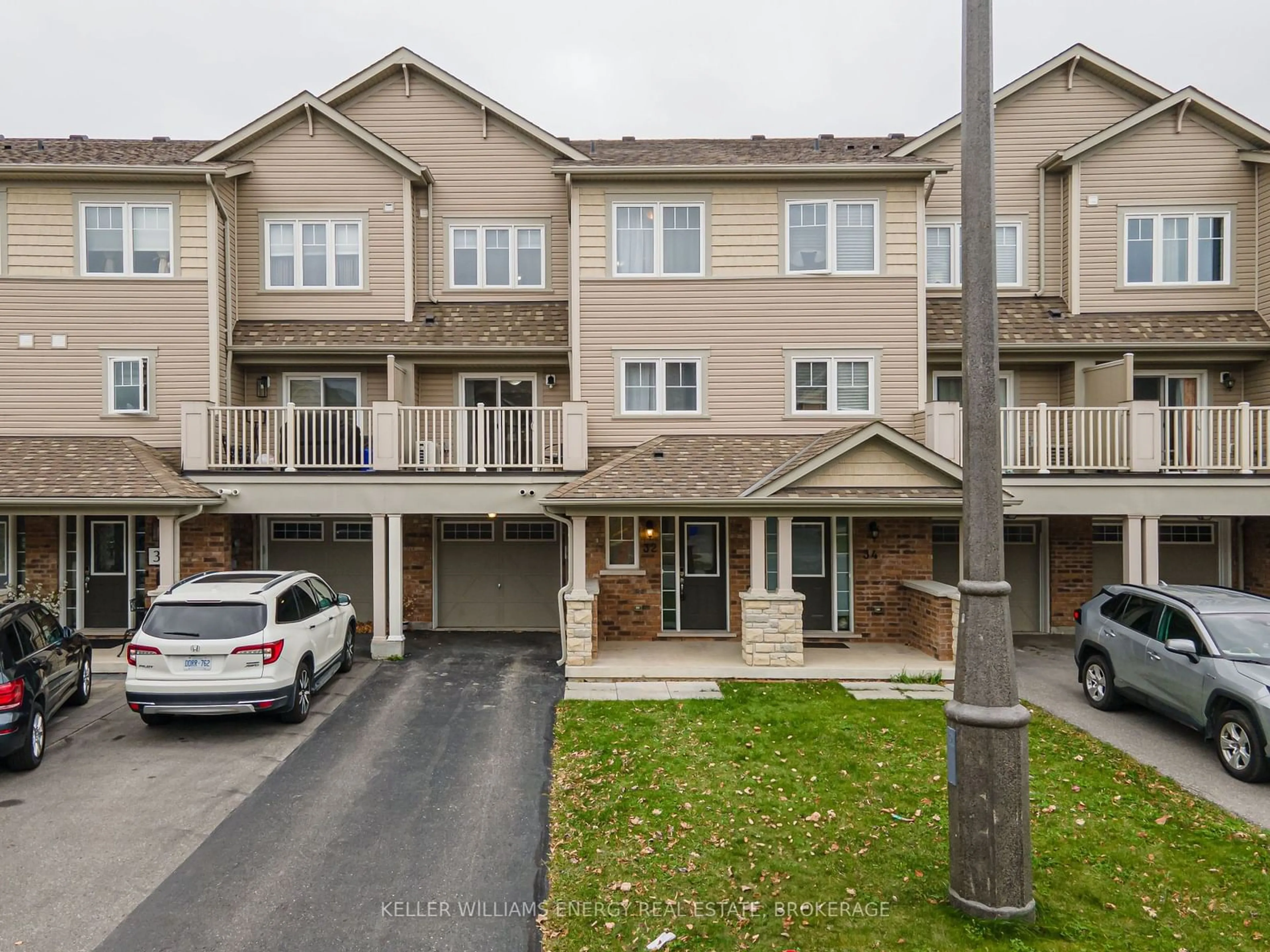 A pic from exterior of the house or condo, the street view for 32 Tabaret Cres, Oshawa Ontario L1L 0G5