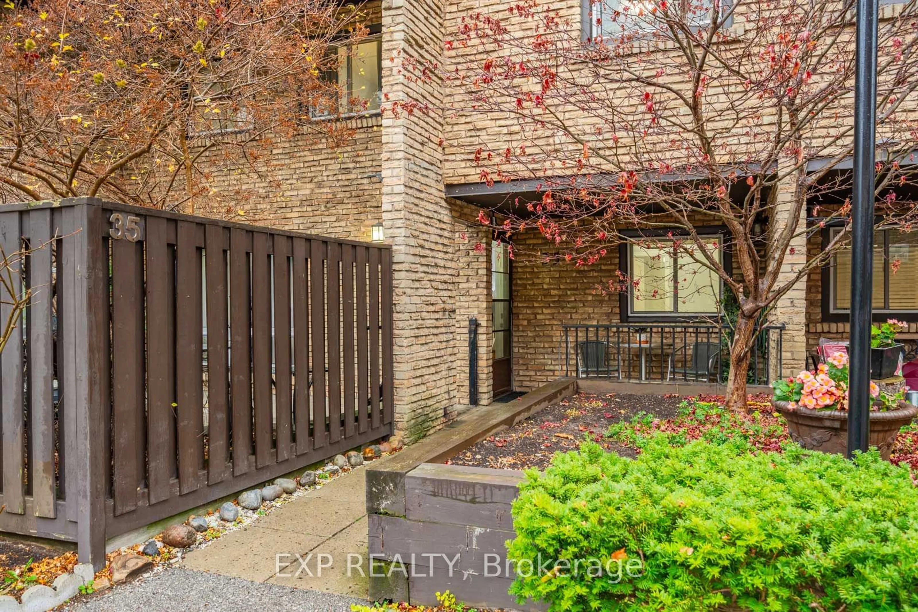 A pic from exterior of the house or condo, the fenced backyard for 120 Ling Rd #35, Toronto Ontario M1E 4V9