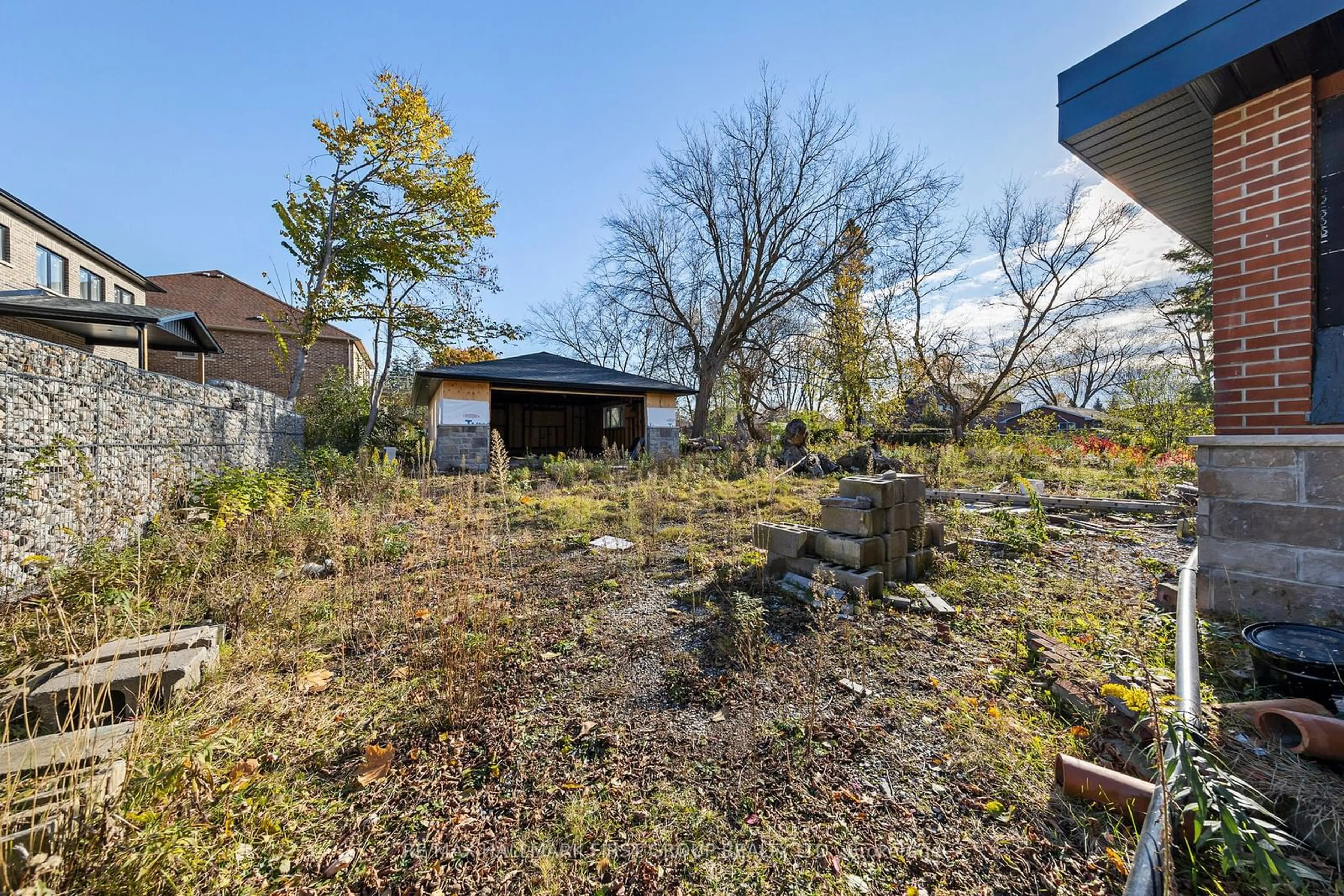 A pic from exterior of the house or condo, the fenced backyard for 515 Ruthel Rd, Ajax Ontario L1S 1E5