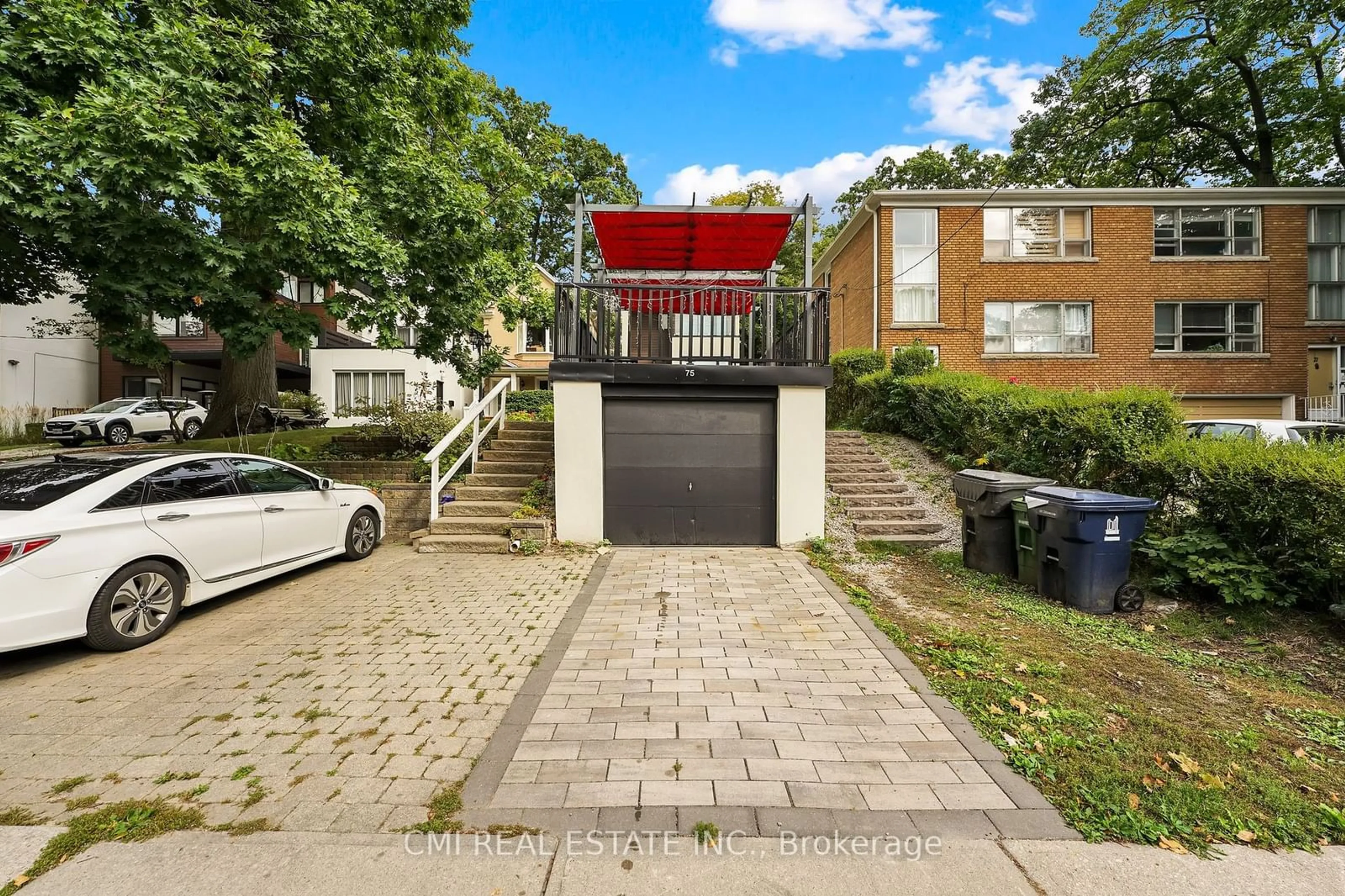 A pic from exterior of the house or condo, the street view for 75 Kenilworth Ave, Toronto Ontario M4L 3S4