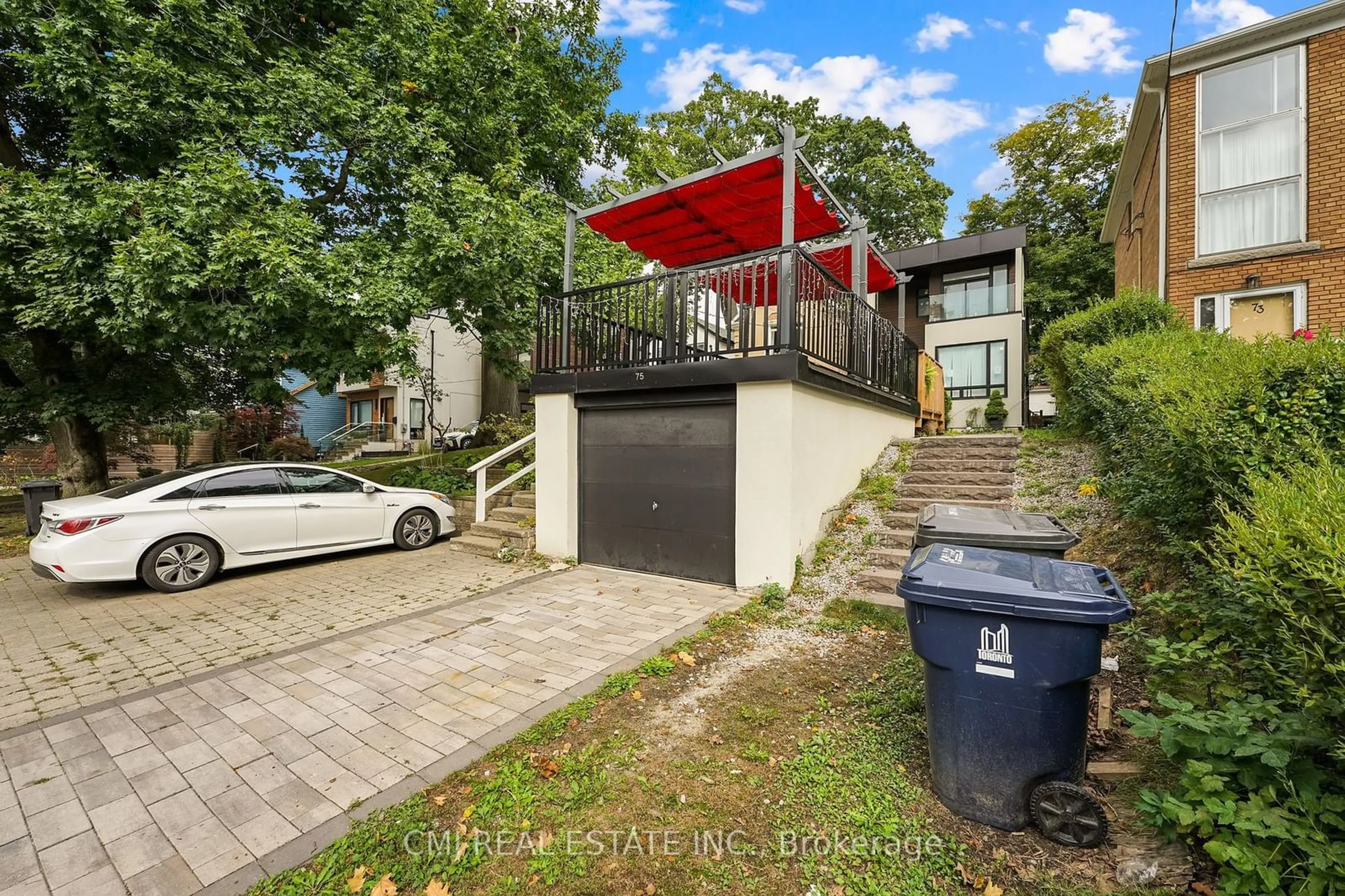 A pic from exterior of the house or condo, the street view for 75 Kenilworth Ave, Toronto Ontario M4L 3S4