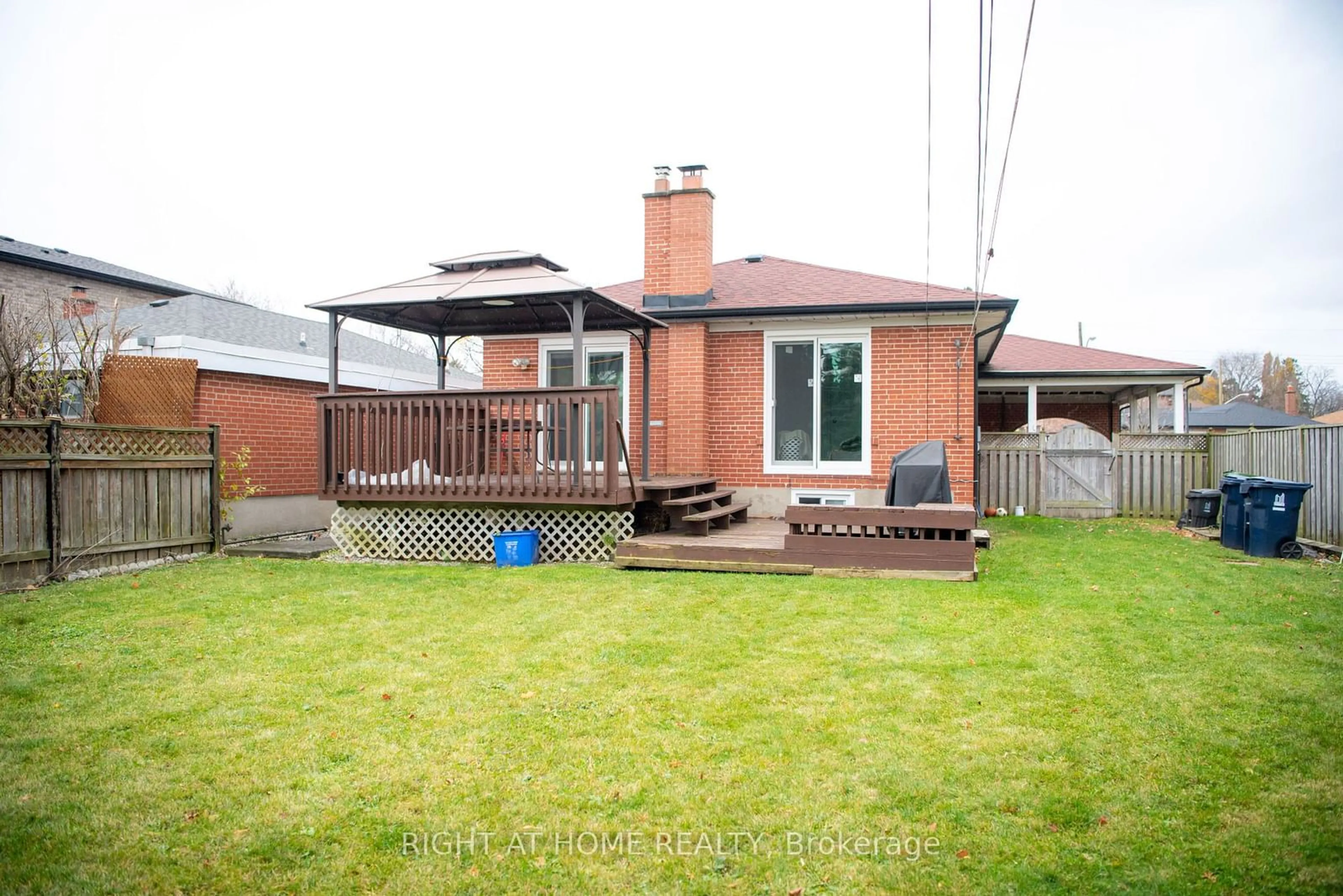 Frontside or backside of a home, the fenced backyard for 22 Beran Dr, Toronto Ontario M1G 1G1