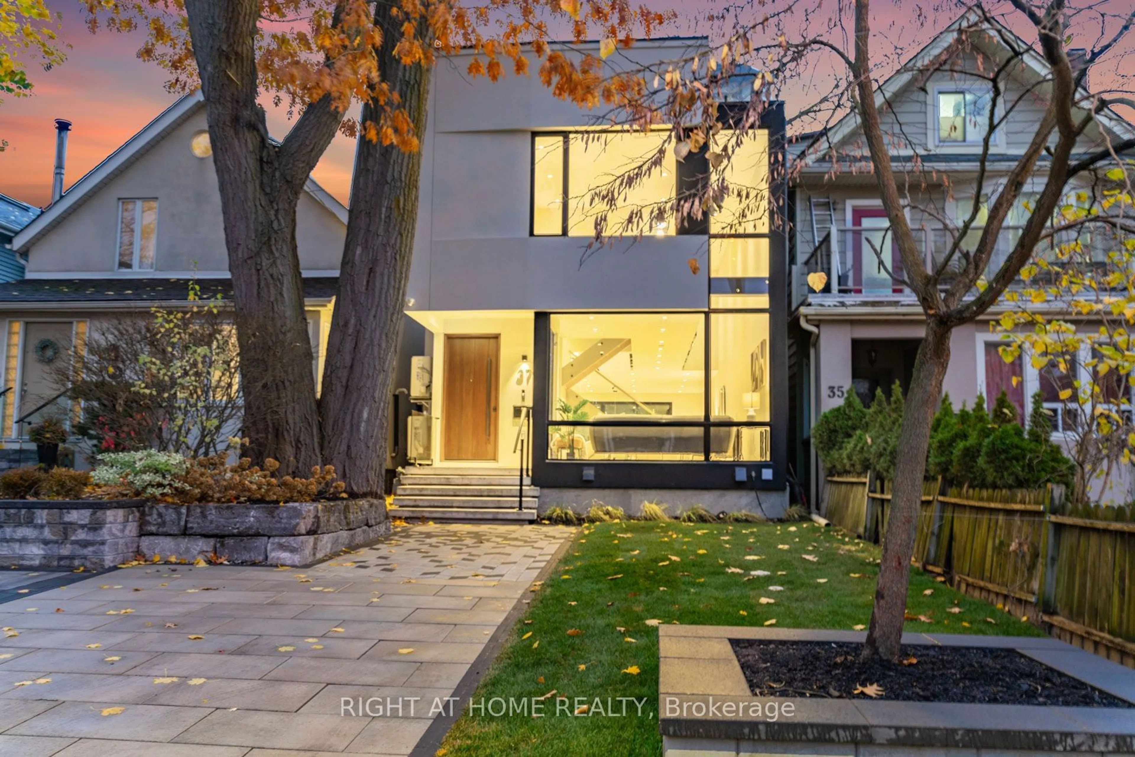 A pic from exterior of the house or condo, the street view for 37 Kenilworth Ave, Toronto Ontario M4L 3S4