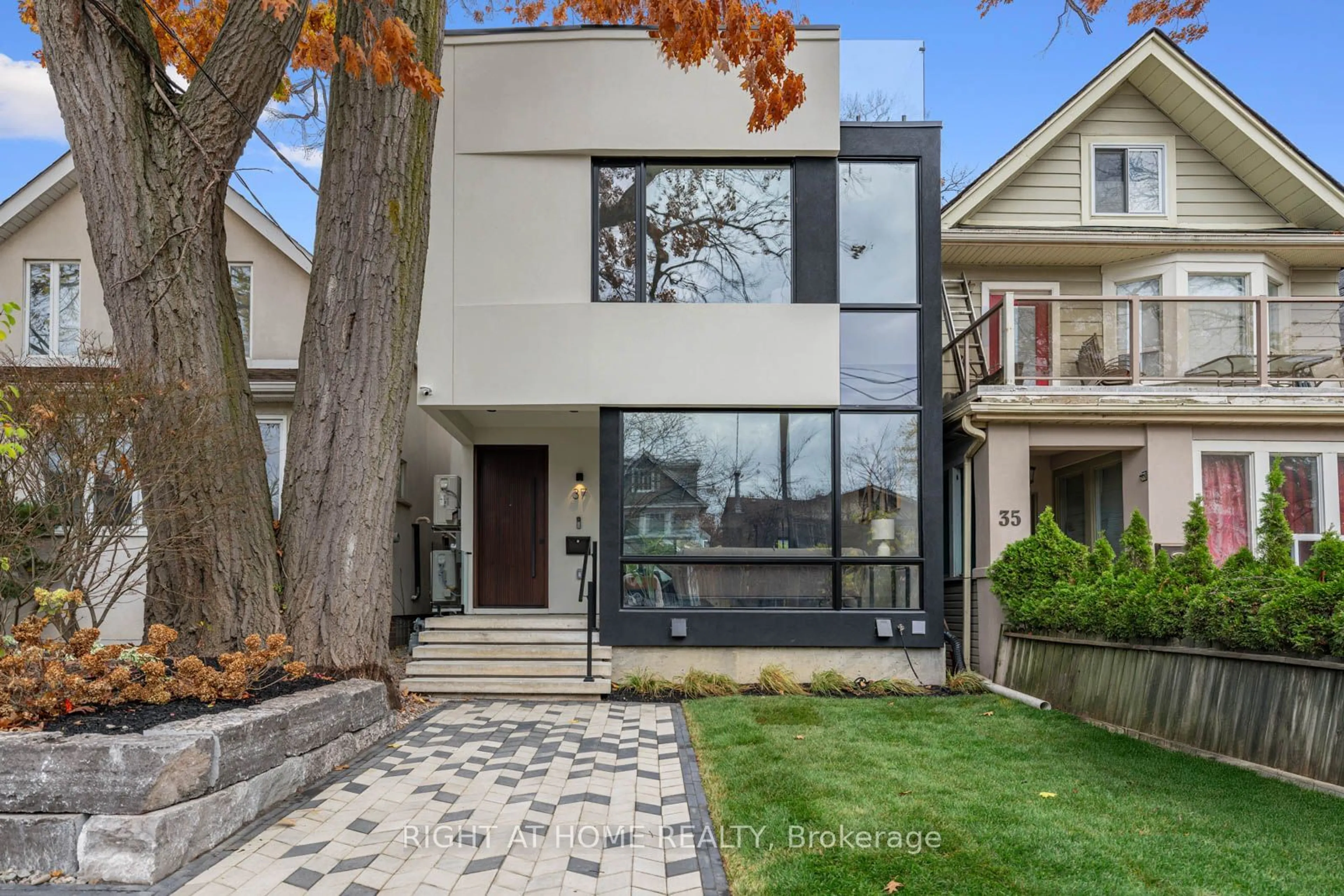 Frontside or backside of a home, the street view for 37 Kenilworth Ave, Toronto Ontario M4L 3S4