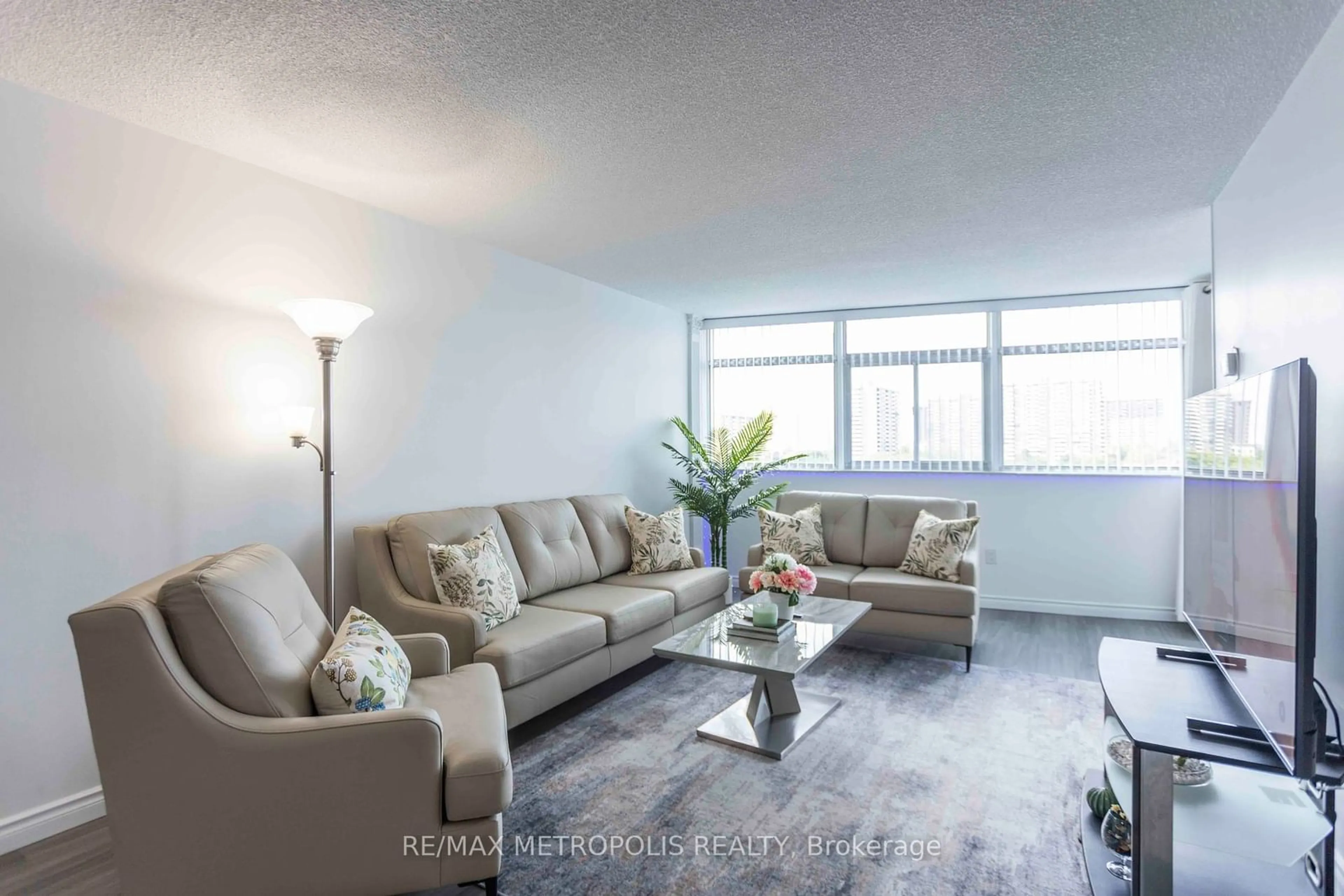 Living room, wood floors for 3151 Bridletowne Circ #808, Toronto Ontario M1W 2T1