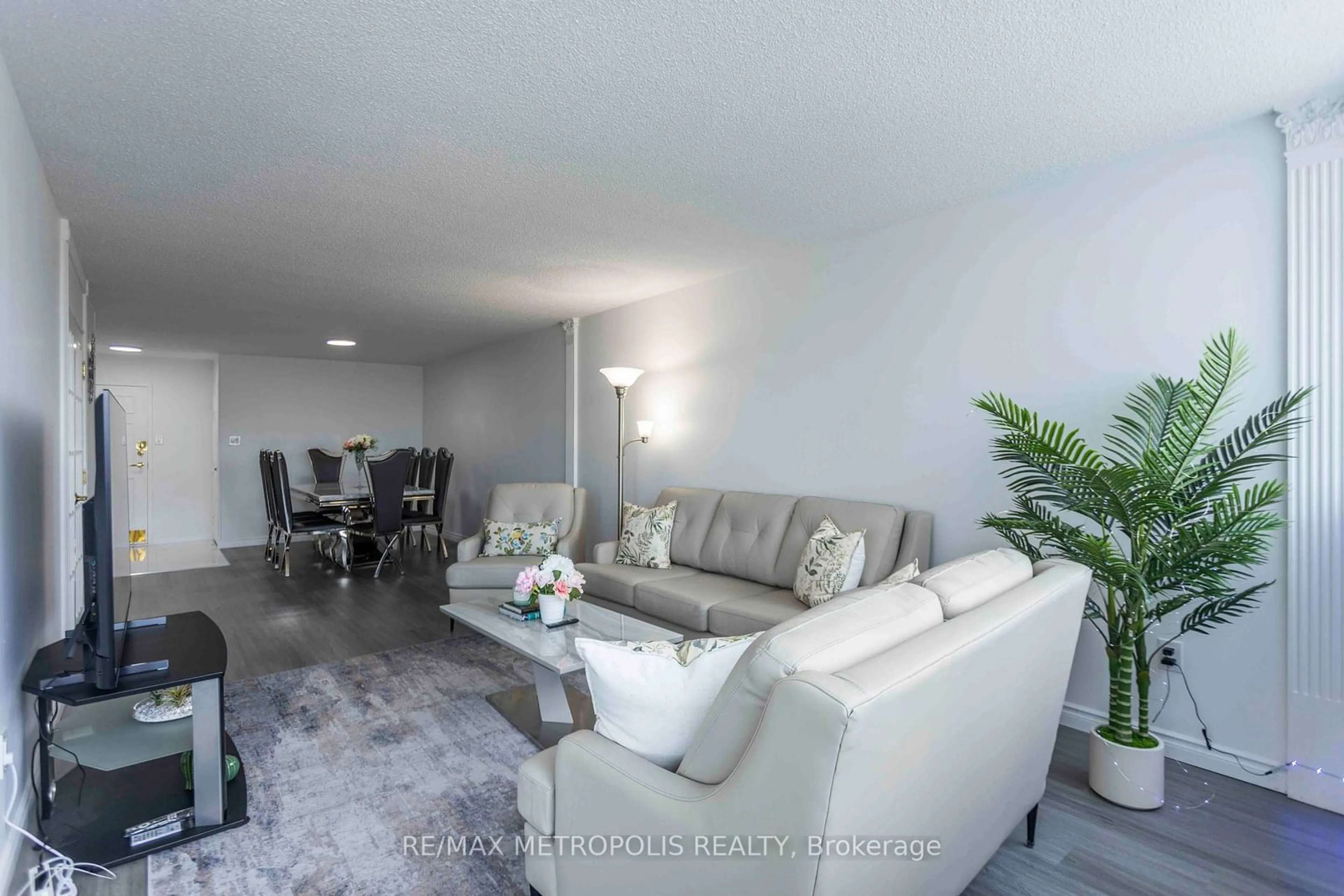 Living room, cement floor for 3151 Bridletowne Circ #808, Toronto Ontario M1W 2T1