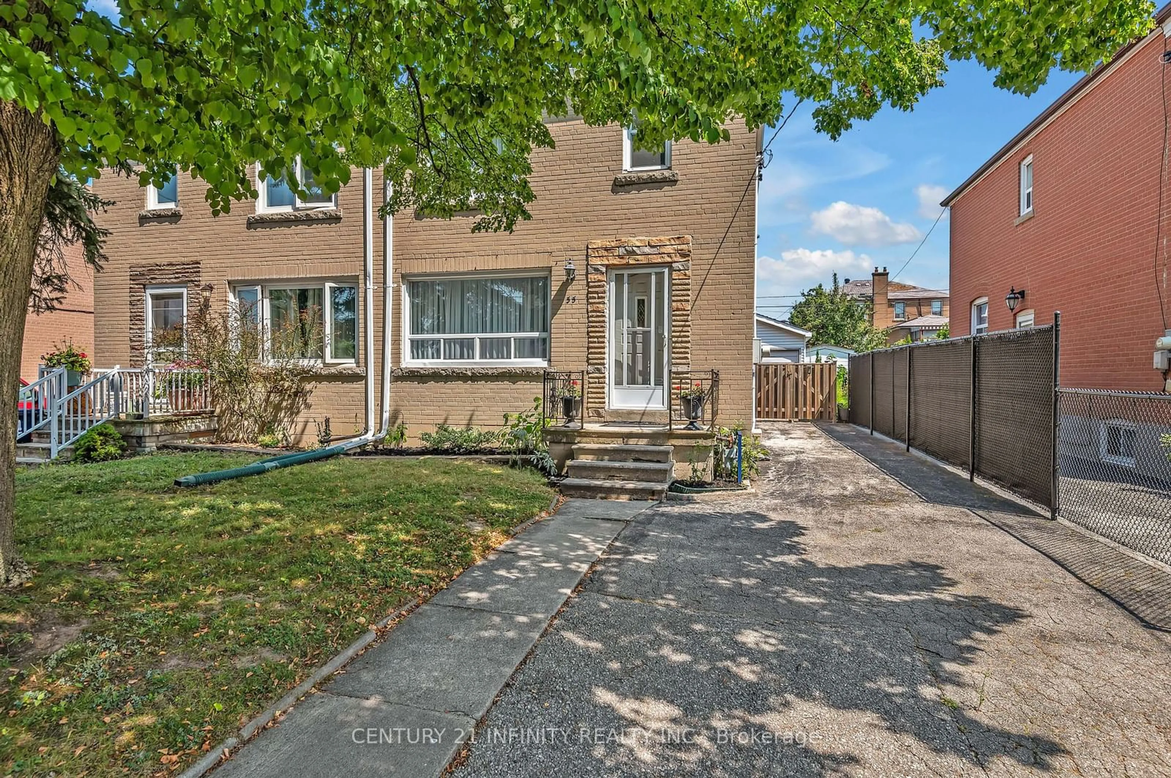 A pic from exterior of the house or condo, the fenced backyard for 55 Laurel Ave, Toronto Ontario M1K 3J4